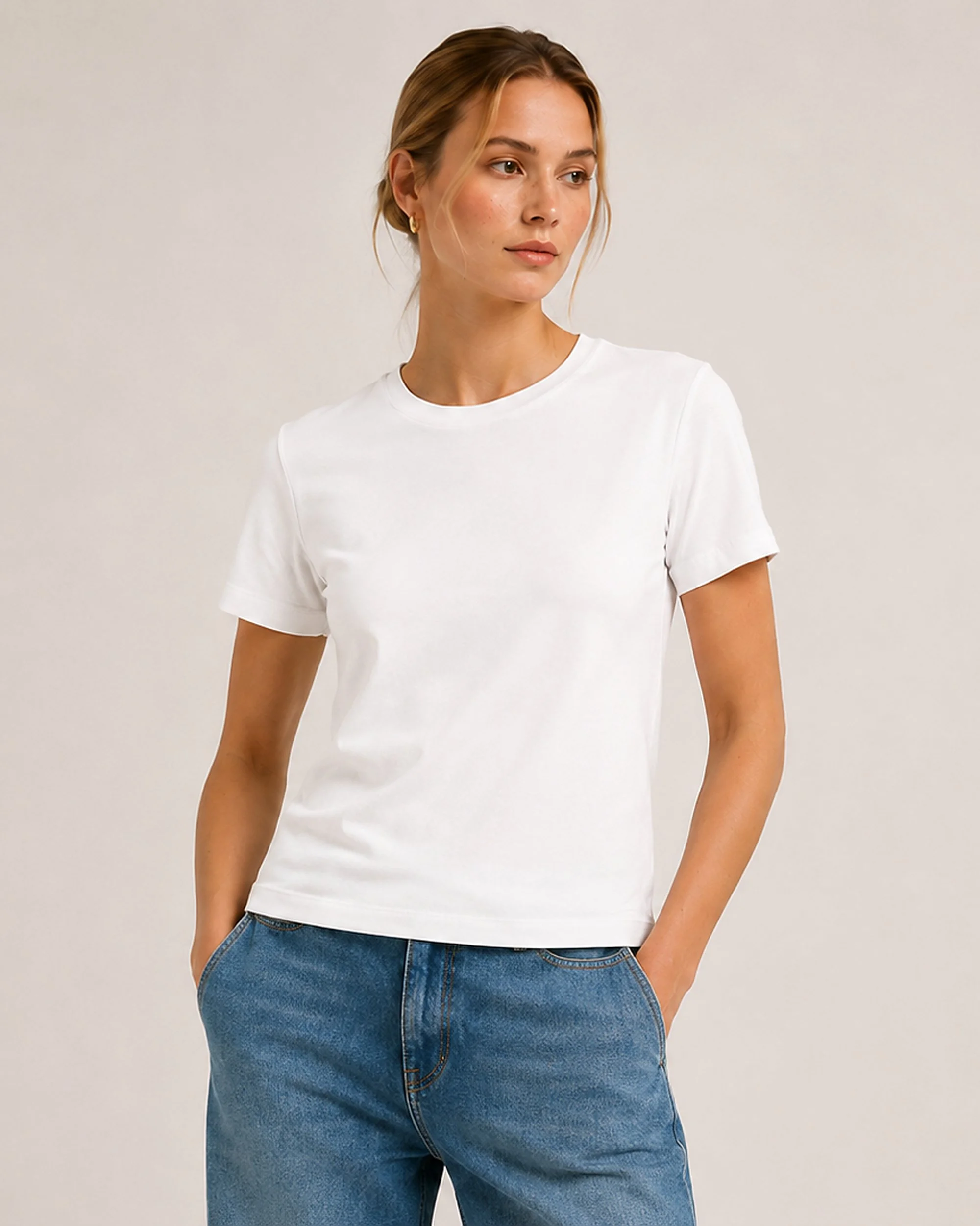 Close-up of The Flax Studio white mercerised cotton T-shirt, showing the neckline and smooth fabric.