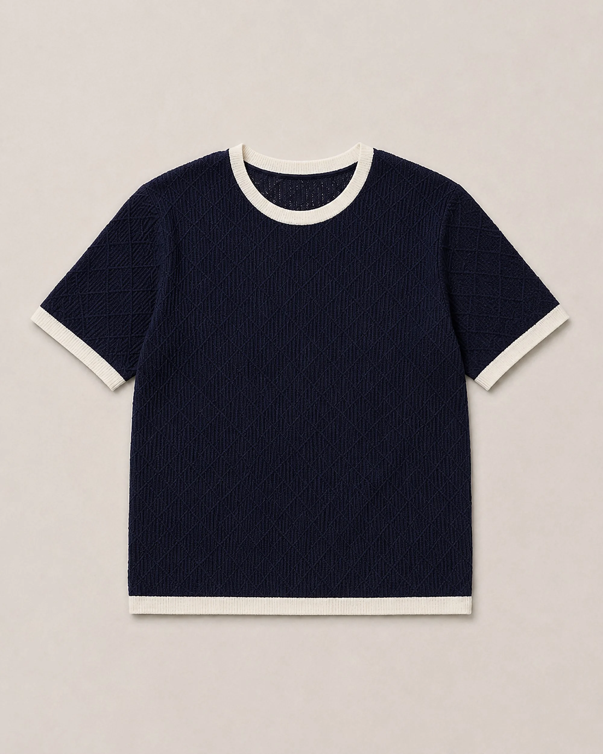 Flat lay of The Flax Studio navy Contrast-Trim Silk-Cotton T-Shirt, showing cream neckline, cuffs and hem.