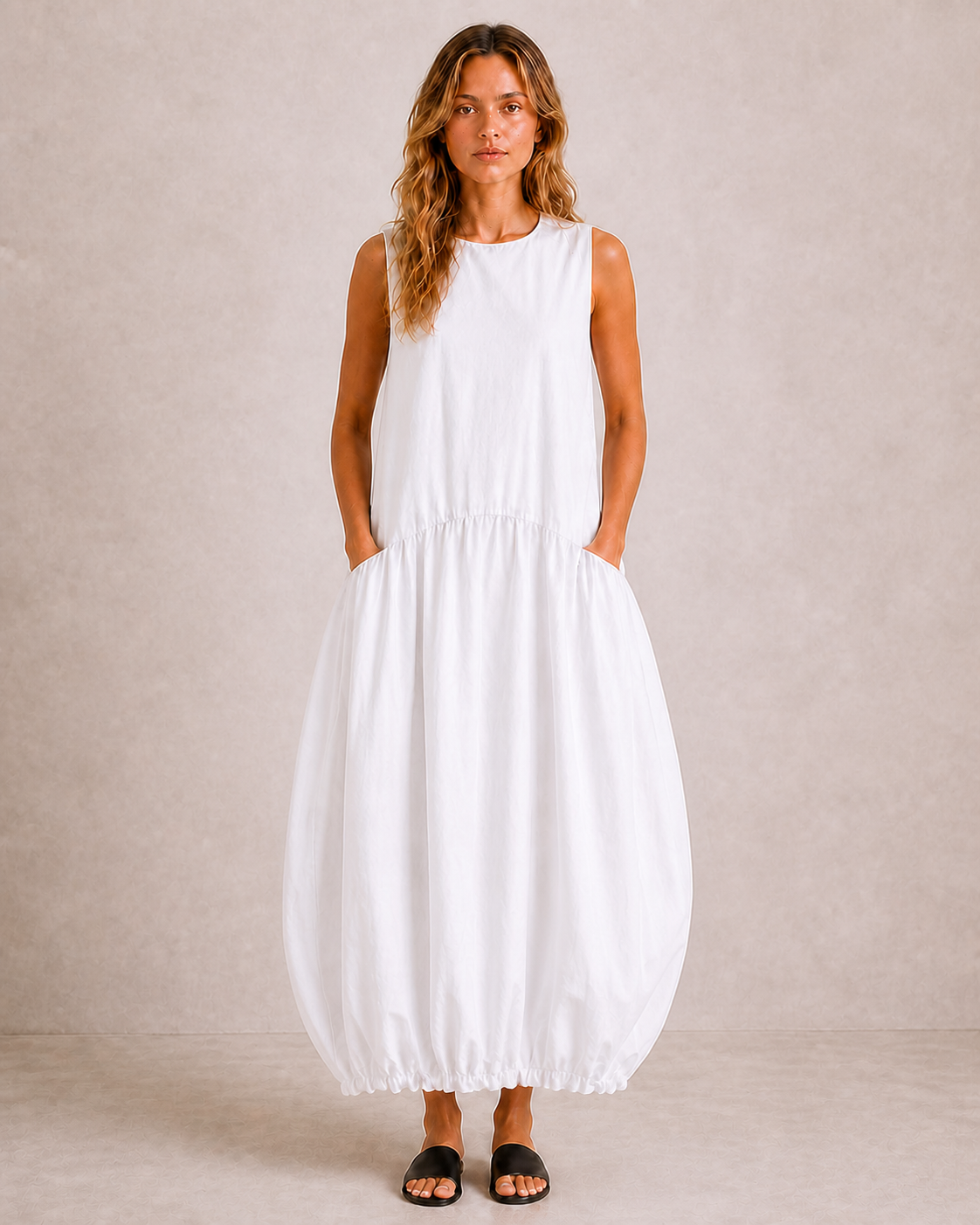 Full-length front view of The Flax Studio white Arc Dress with a softly elasticated hem.