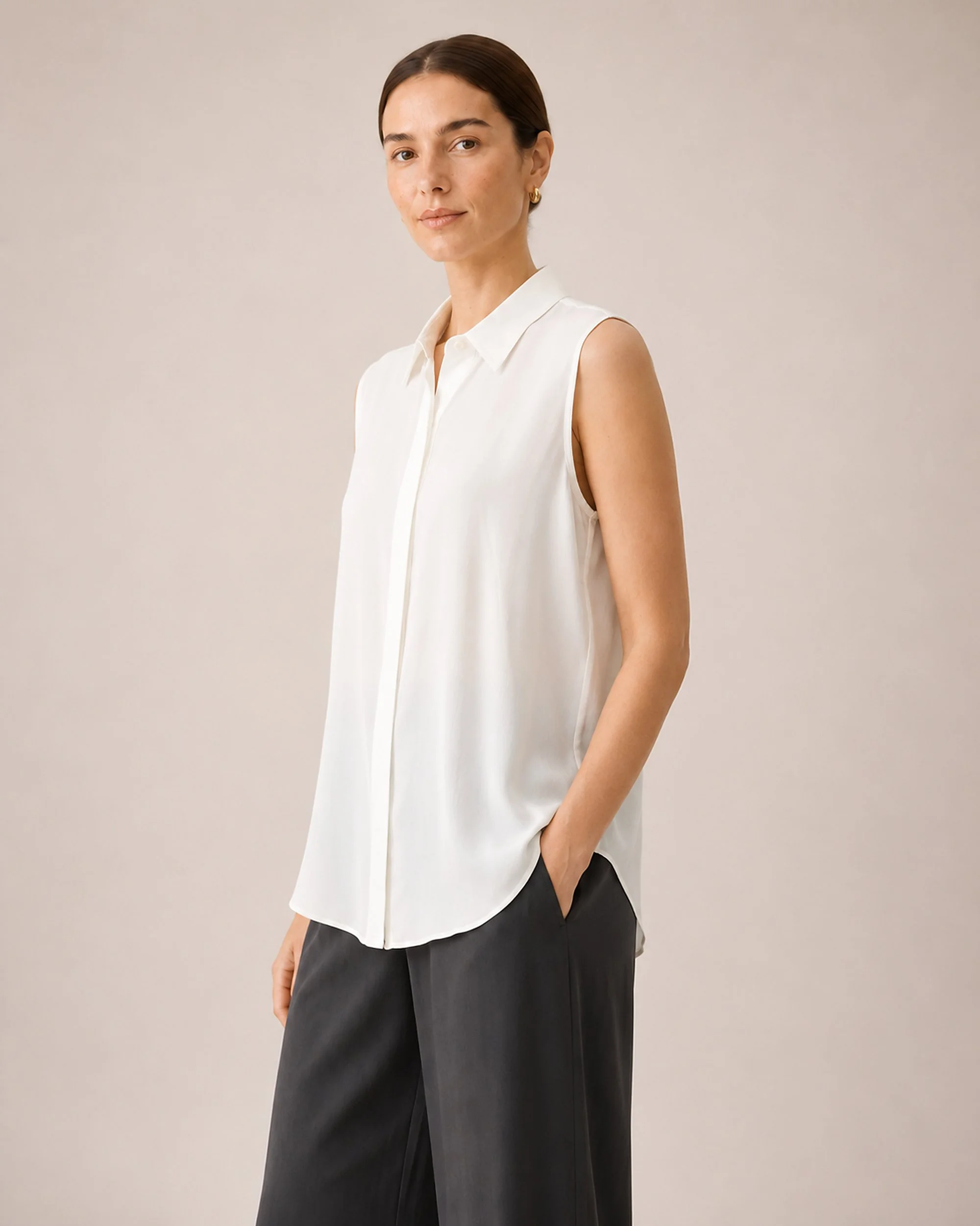 The Flax Studio white Mulberry Silk Sleeveless Blouse, showing its pointed collar and fluid drape.