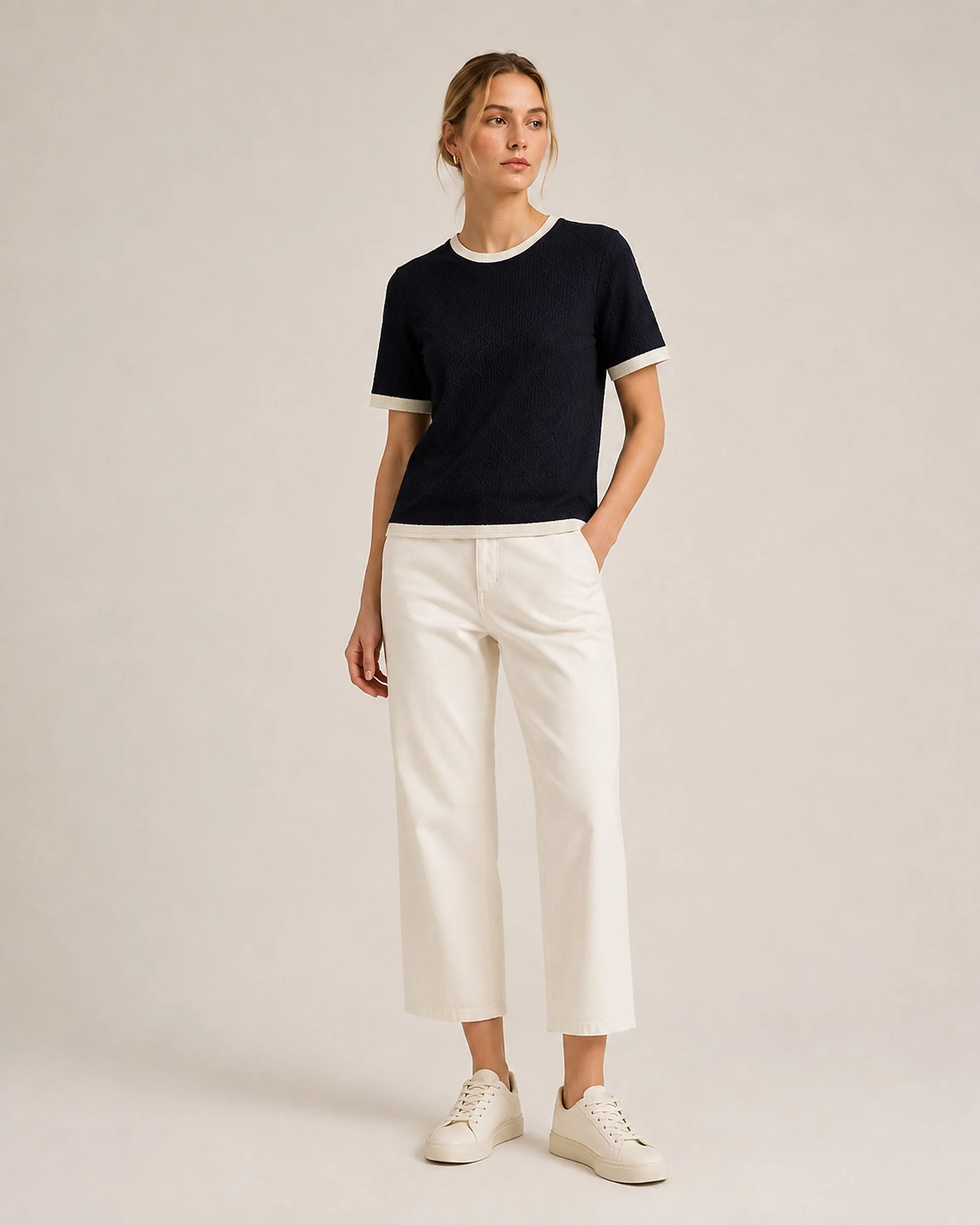 The Flax Studio navy Contrast-Trim Silk-Cotton T-Shirt styled with cream trousers.