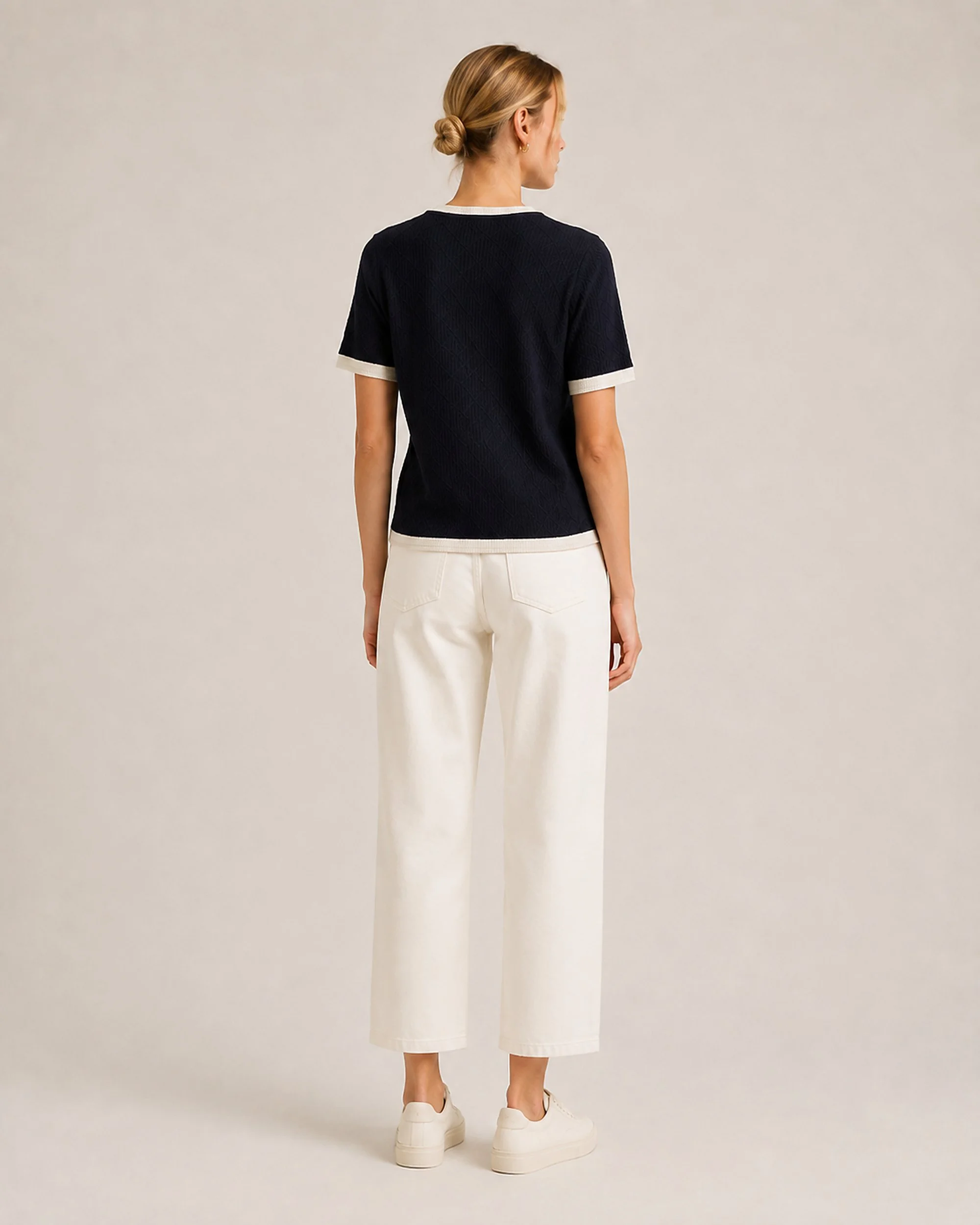 Back view of The Flax Studio navy Contrast-Trim Silk-Cotton T-Shirt with cream sleeve and hem trims.