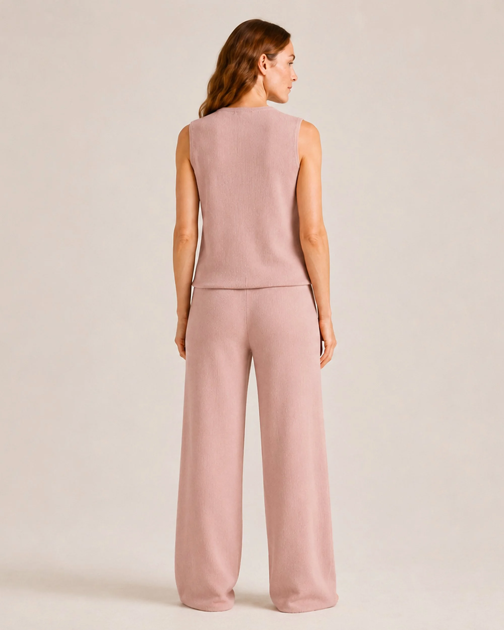 Back view of The Flax Studio Fine Rib Knit Set in Tan, with matching full-length pants.