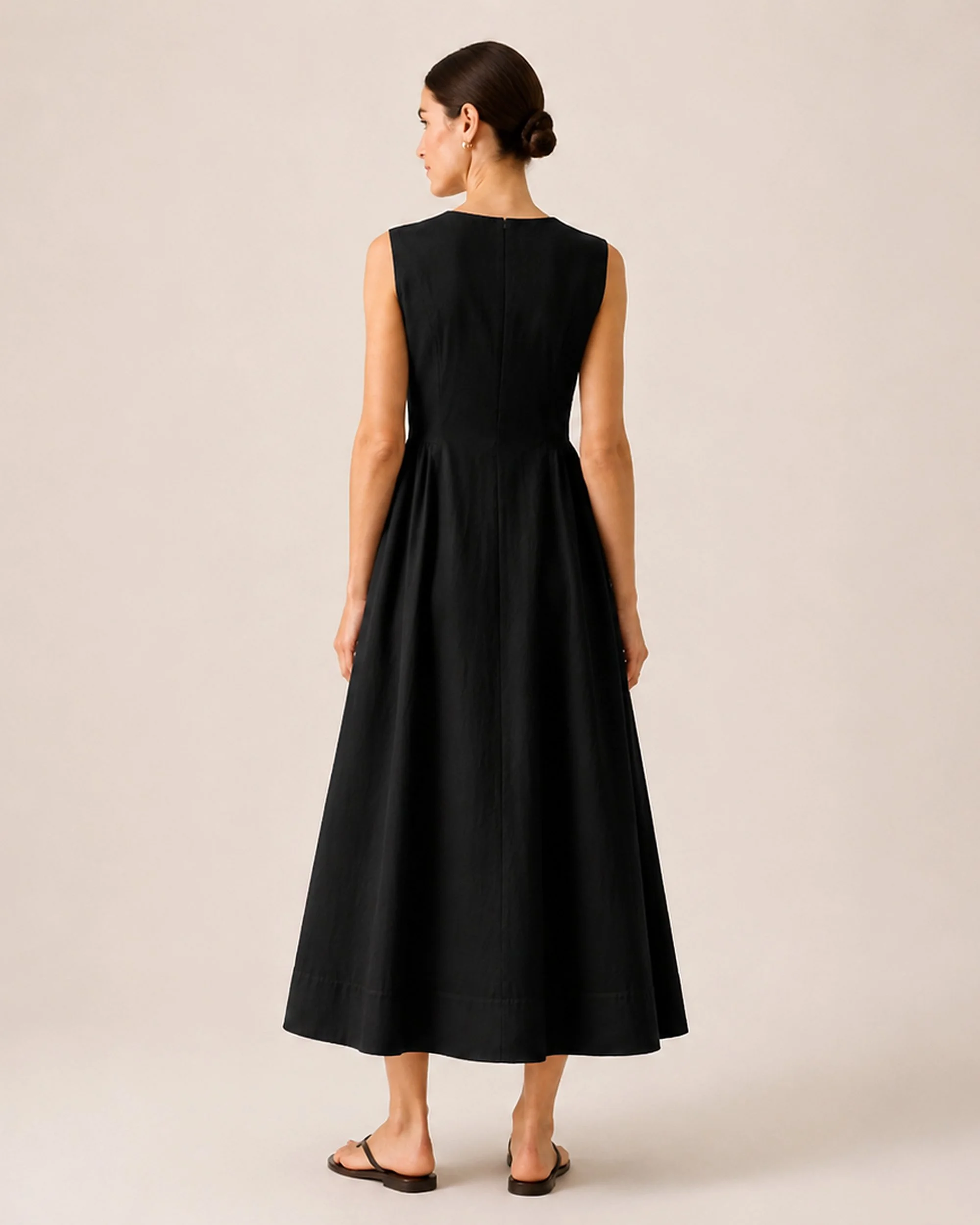 Back view of The Flax Studio black Tailored Dress with an ankle-length A-line silhouette.