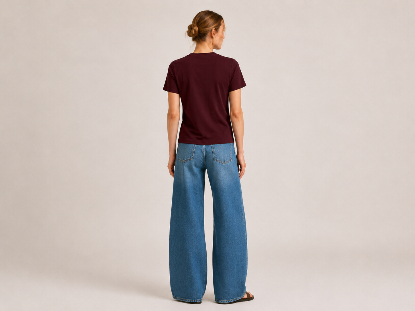 Back view of The Flax Studio chocolate mercerised cotton T-shirt, showing the straight hem and short sleeves.