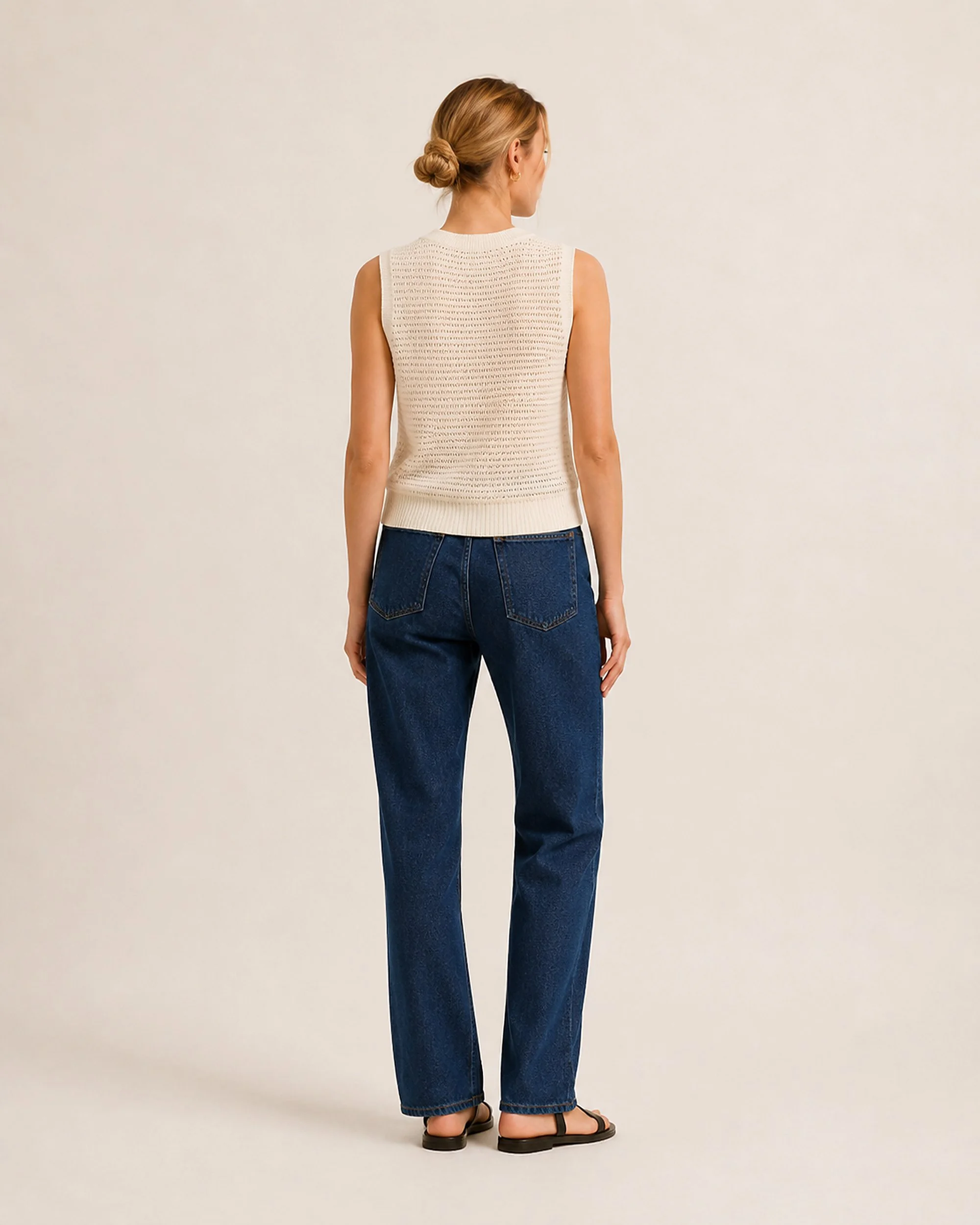 Full-length front view of The Flax Studio cream Open-Knit Silk-Cotton Tank worn with jeans.