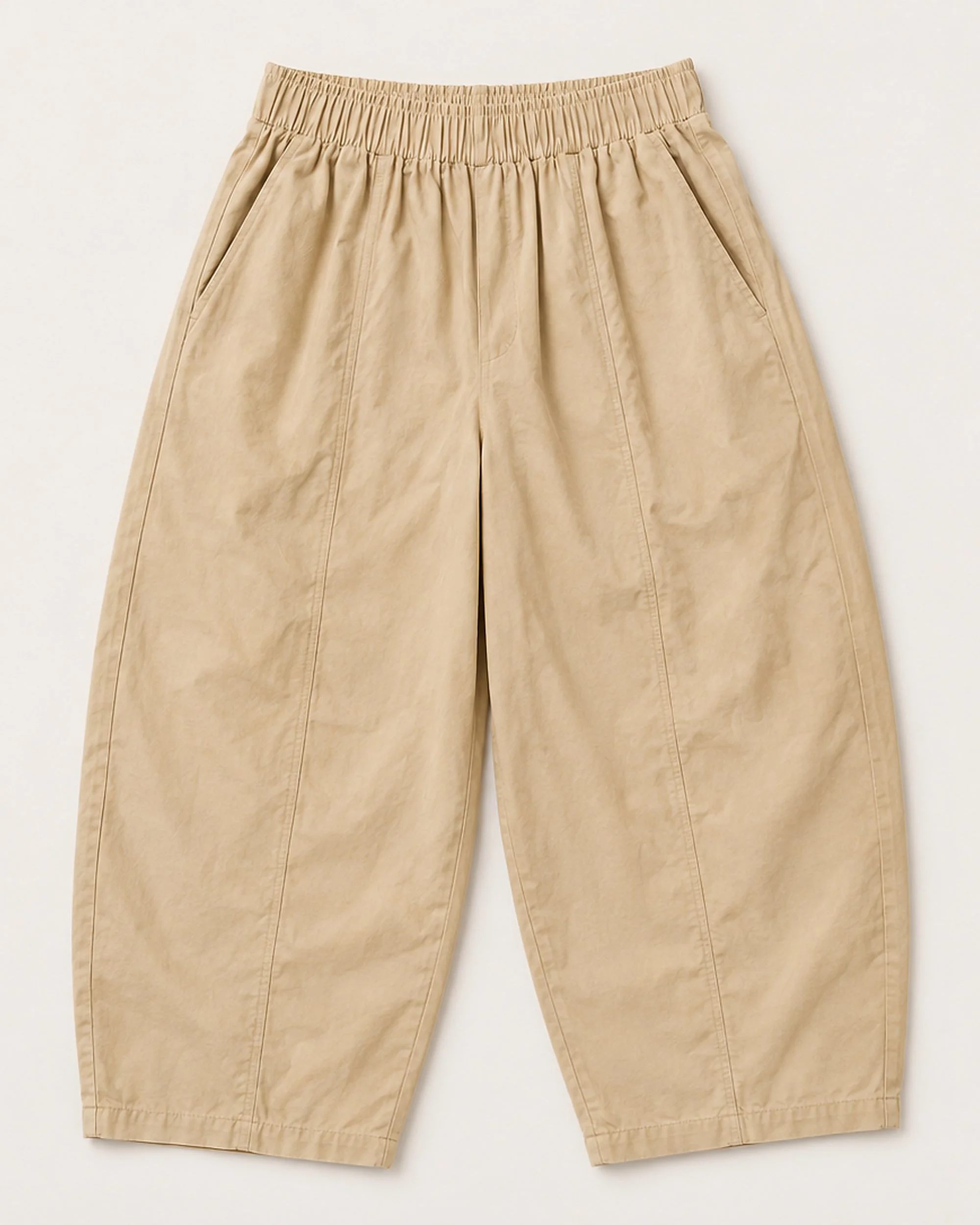 Flat lay of The Flax Studio tan Sculpted Cotton Pant with a gathered waistband and centre seams.