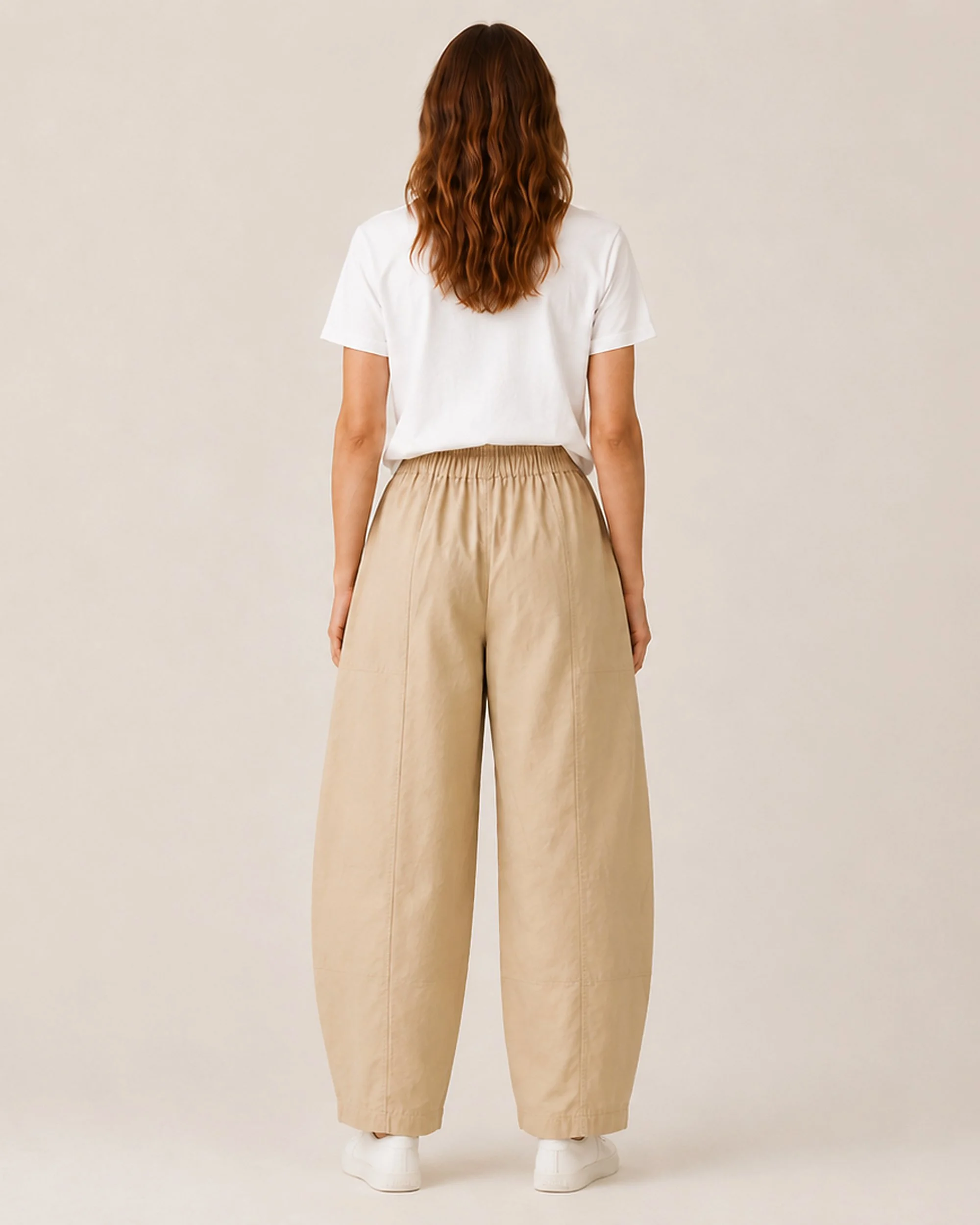 Back view of The Flax Studio tan Sculpted Cotton Pant with its relaxed curved-leg silhouette.