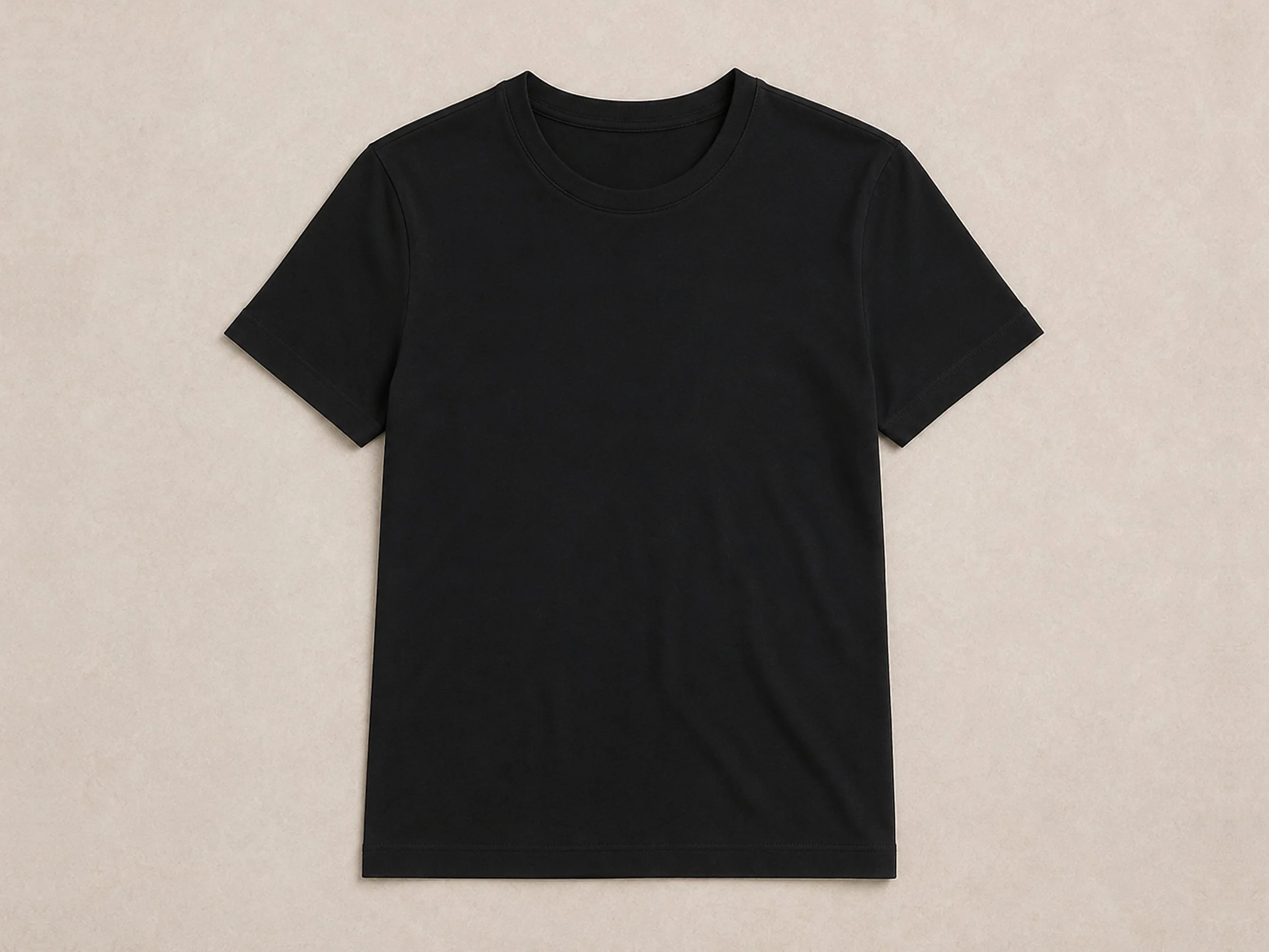 Flat lay of The Flax Studio black mercerised cotton T-shirt with a crew neckline and short sleeves.