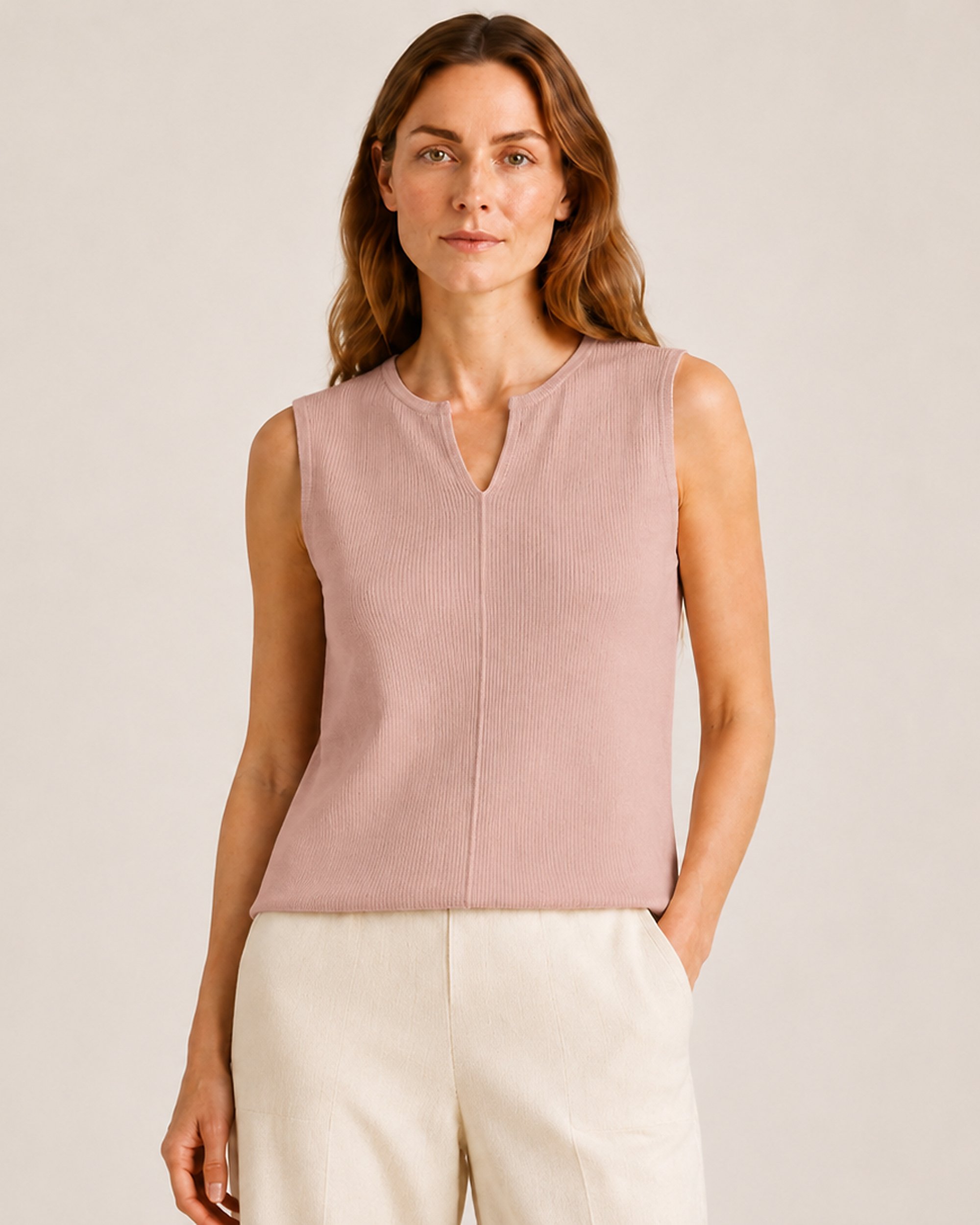 The Flax Studio Fine Rib Knit Set top in Tan, styled with light-coloured pants.