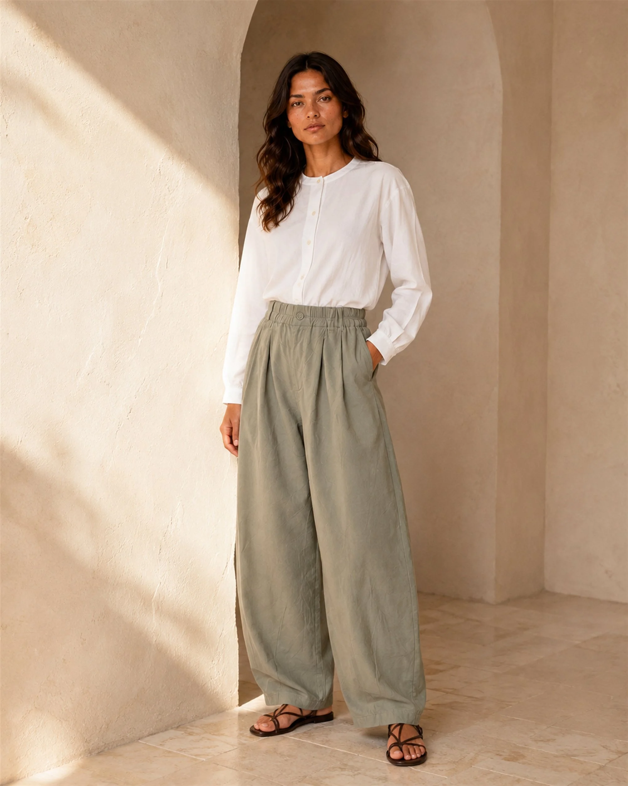 The Flax Studio khaki Button Front Crepe Pant paired with a white long-sleeved blouse, front styling view.