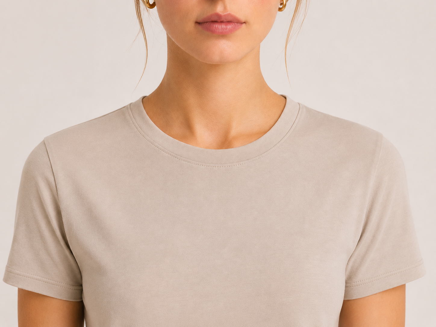 Close-up of the crew neckline on The Flax Studio sand mercerised cotton T-shirt.