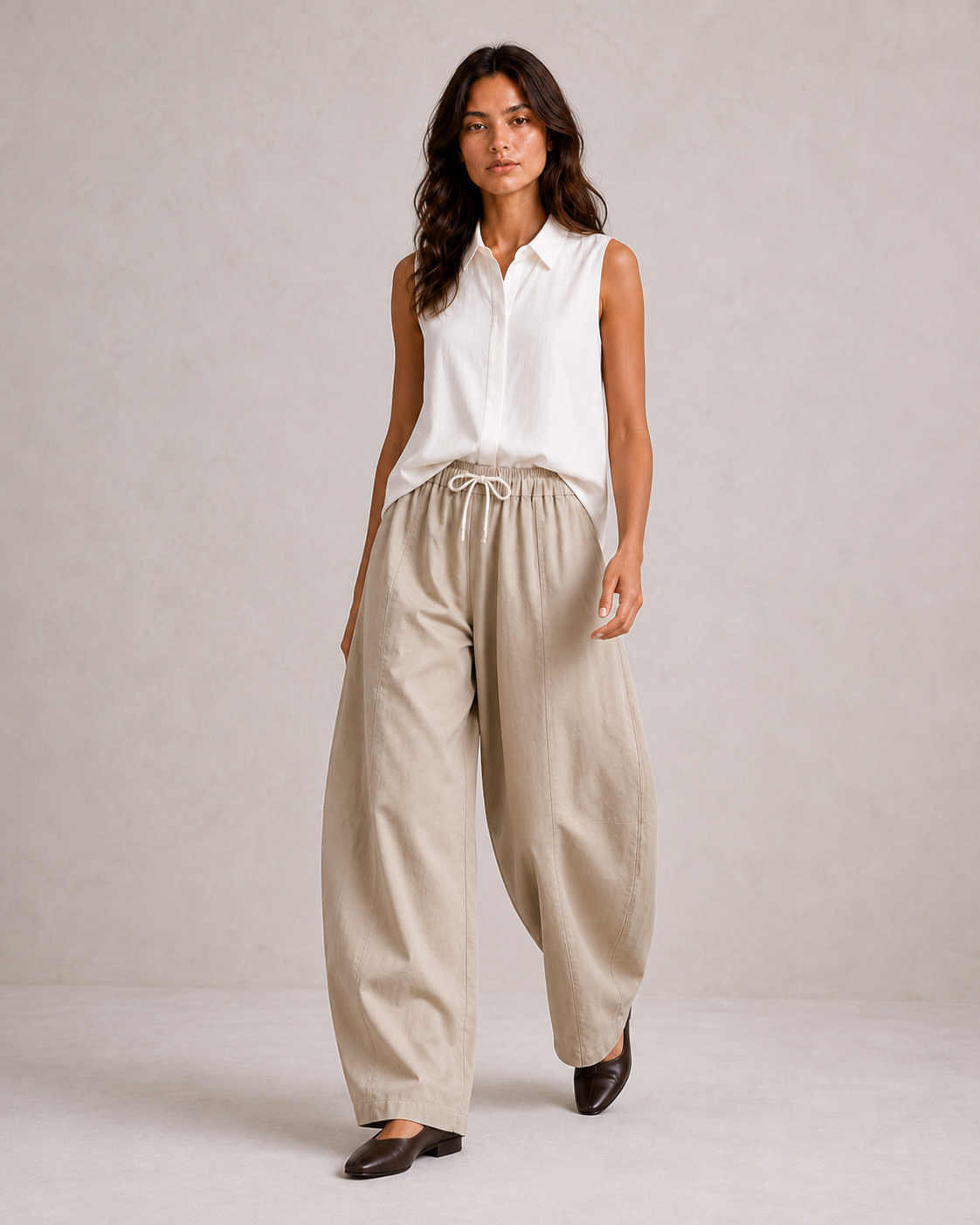 The Flax Studio tan Esme Pant worn with a white sleeveless top, showing the full-length relaxed fit.
