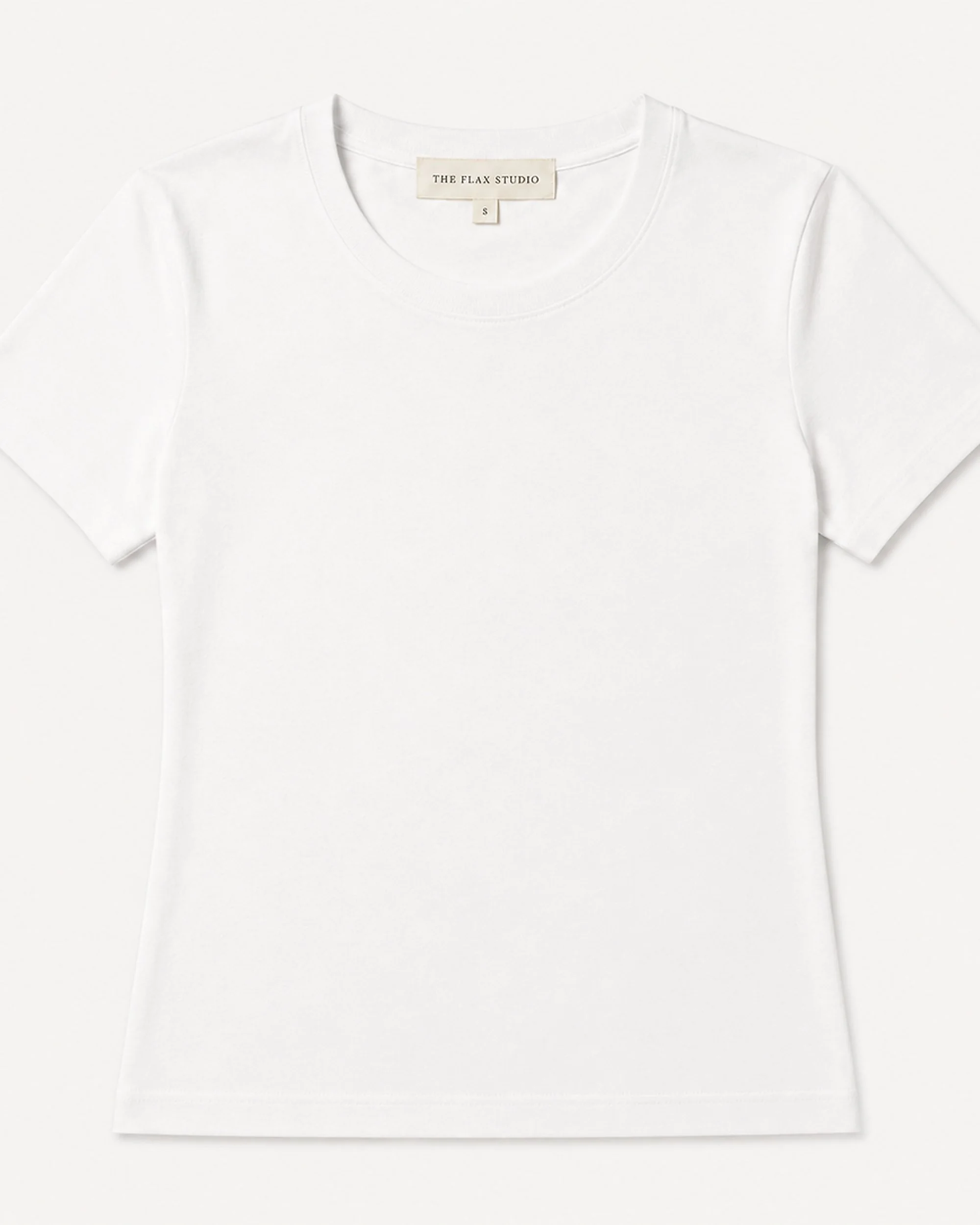 Flat lay of The Flax Studio white mercerised cotton T-shirt with a crew neckline and short sleeves.