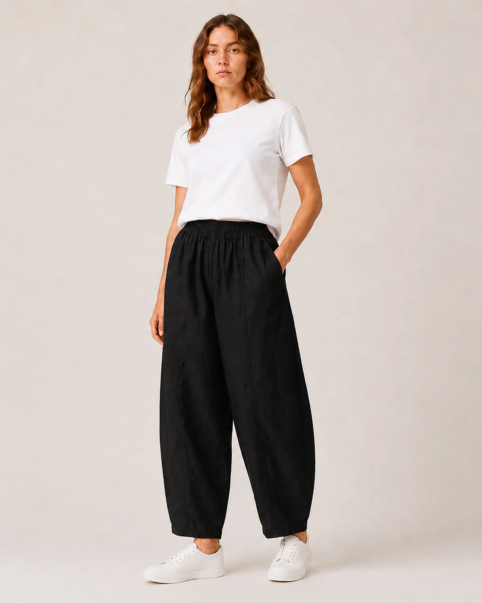 The Flax Studio Sculpted Cotton Pant in black, showing the alternative colour styled with a white T-shirt.