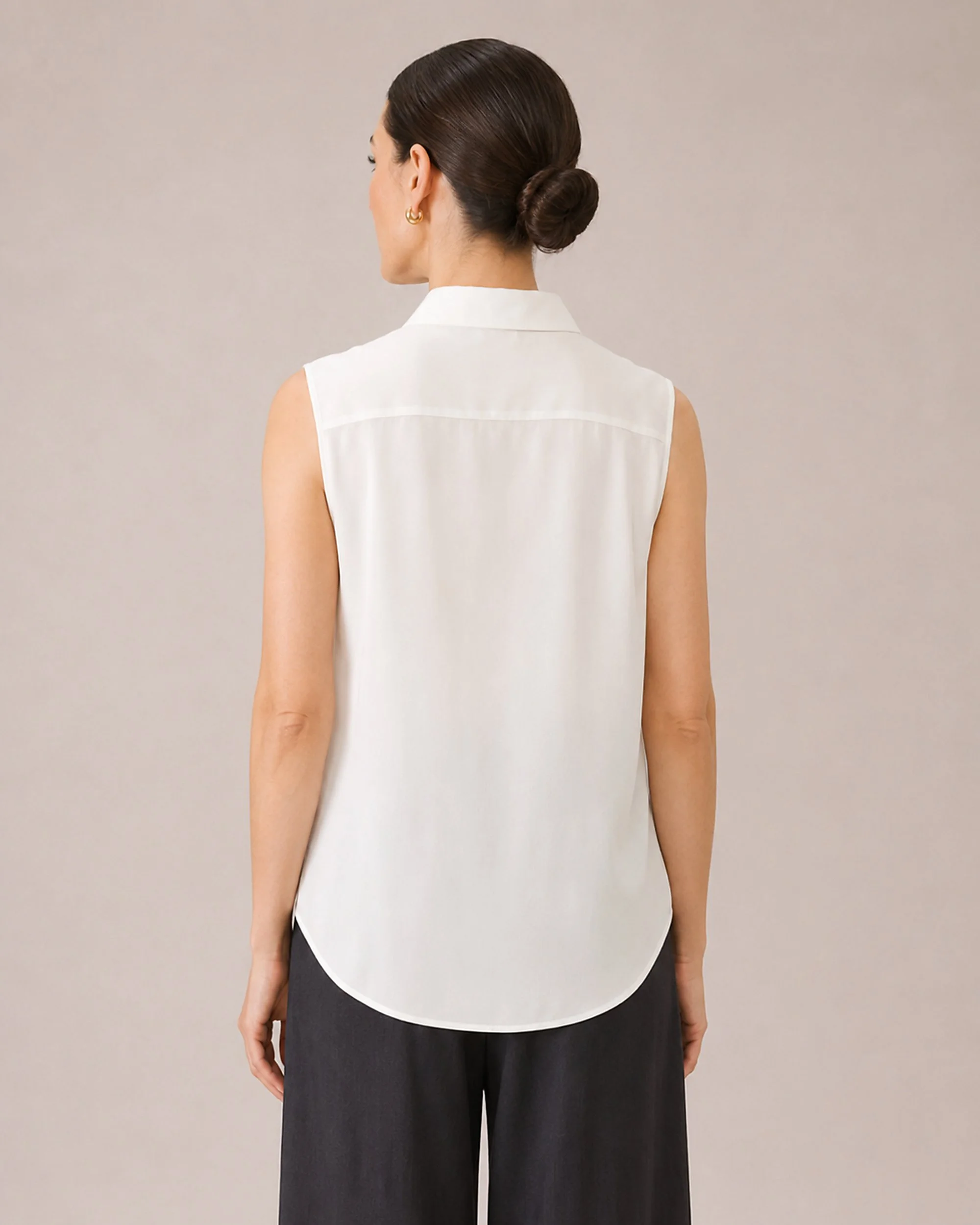 Back detail of The Flax Studio white Mulberry Silk Sleeveless Blouse, showing the yoke and shaping.