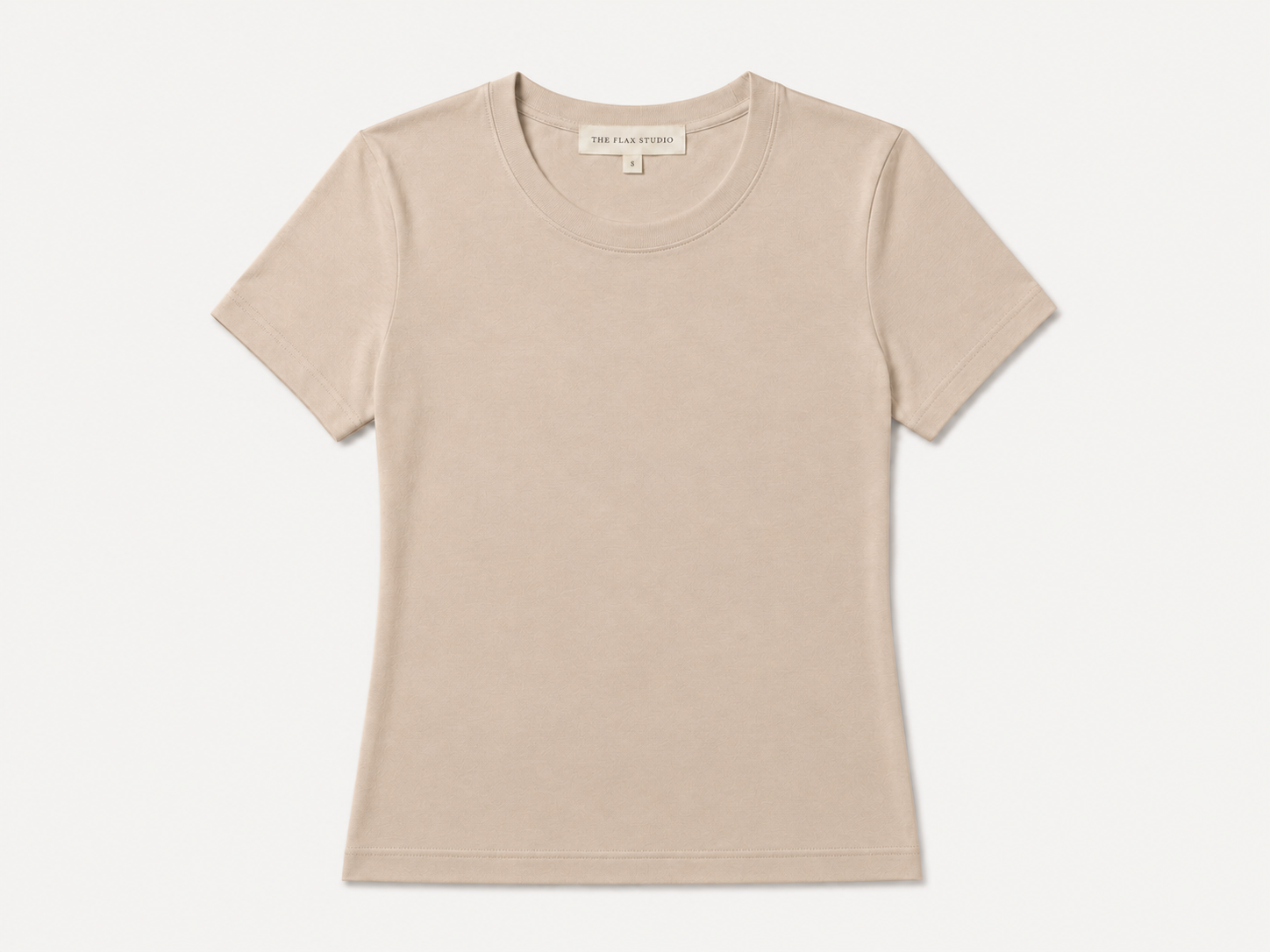 Flat lay of The Flax Studio sand mercerised cotton T-shirt with a crew neckline and short sleeves.