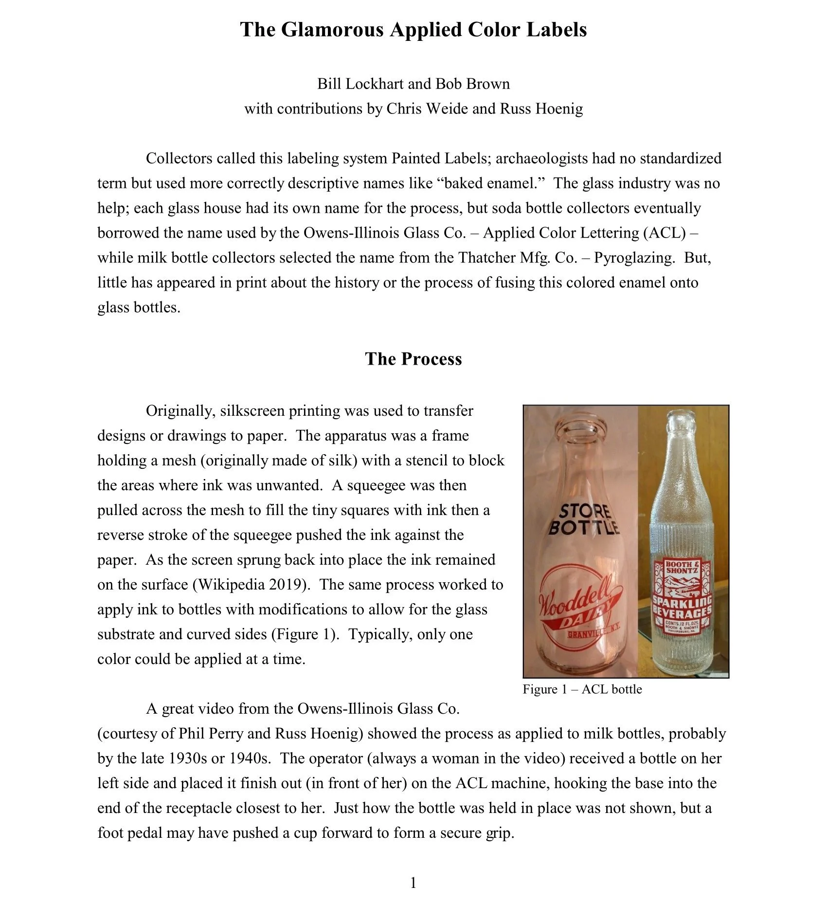 Photograph of two glass bottles, one with a pinkish hue labeled 'Wooded Dale,' and the other clear with a vintage-style label 'Booth & Shontz Sparkling Beverages,' placed side by side on a light-colored surface, with the pink bottle partially in fron