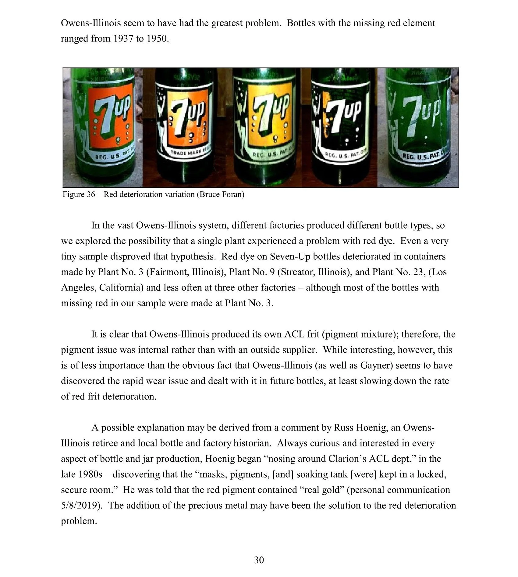 Photograph of five glass bottles with label featuring a green seven and a white number two, with varying degrees of red coloration on the labels, placed on a surface, illustrating color deterioration over time.