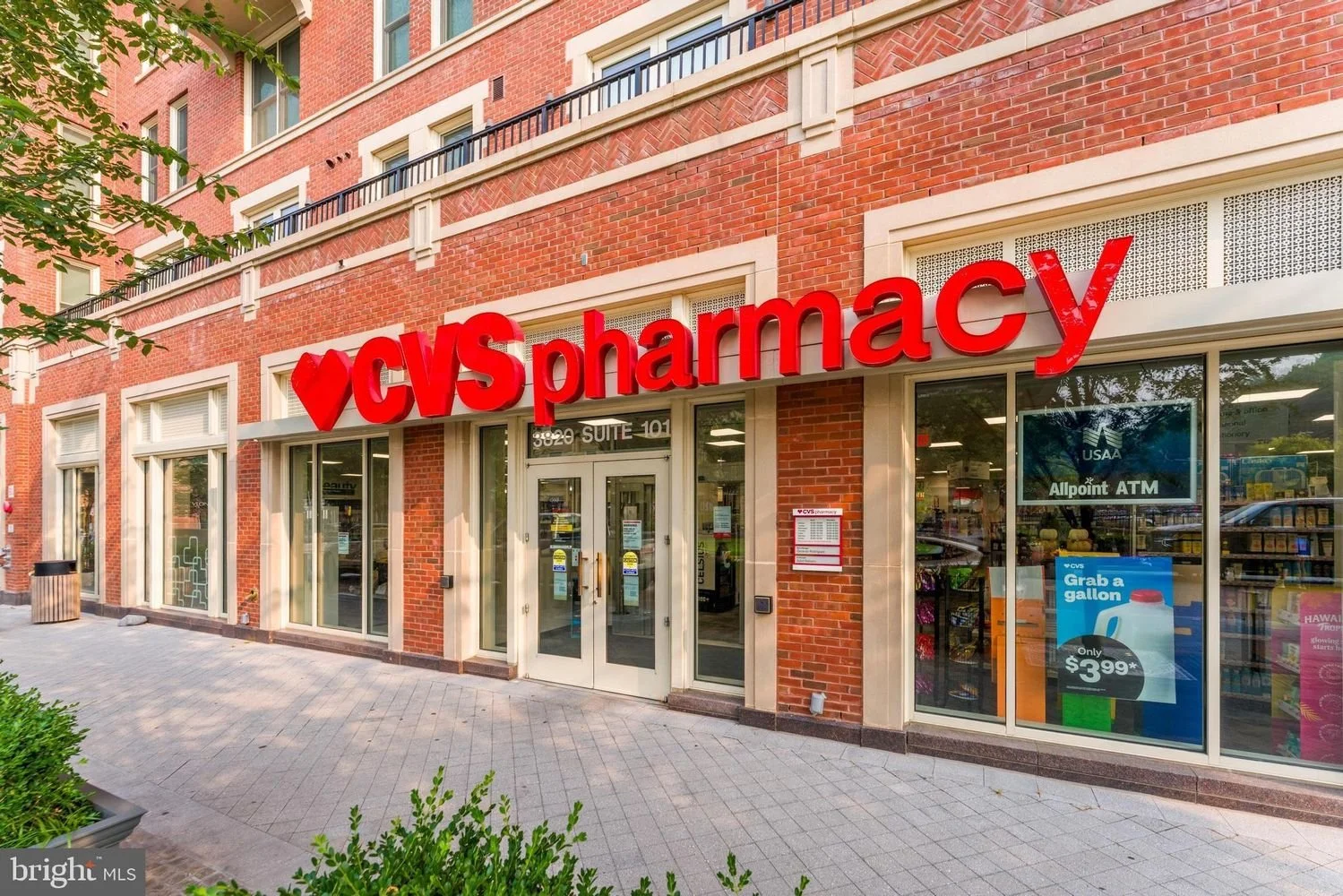 Exterior of a CVS Pharmacy store with red signage on a brick building