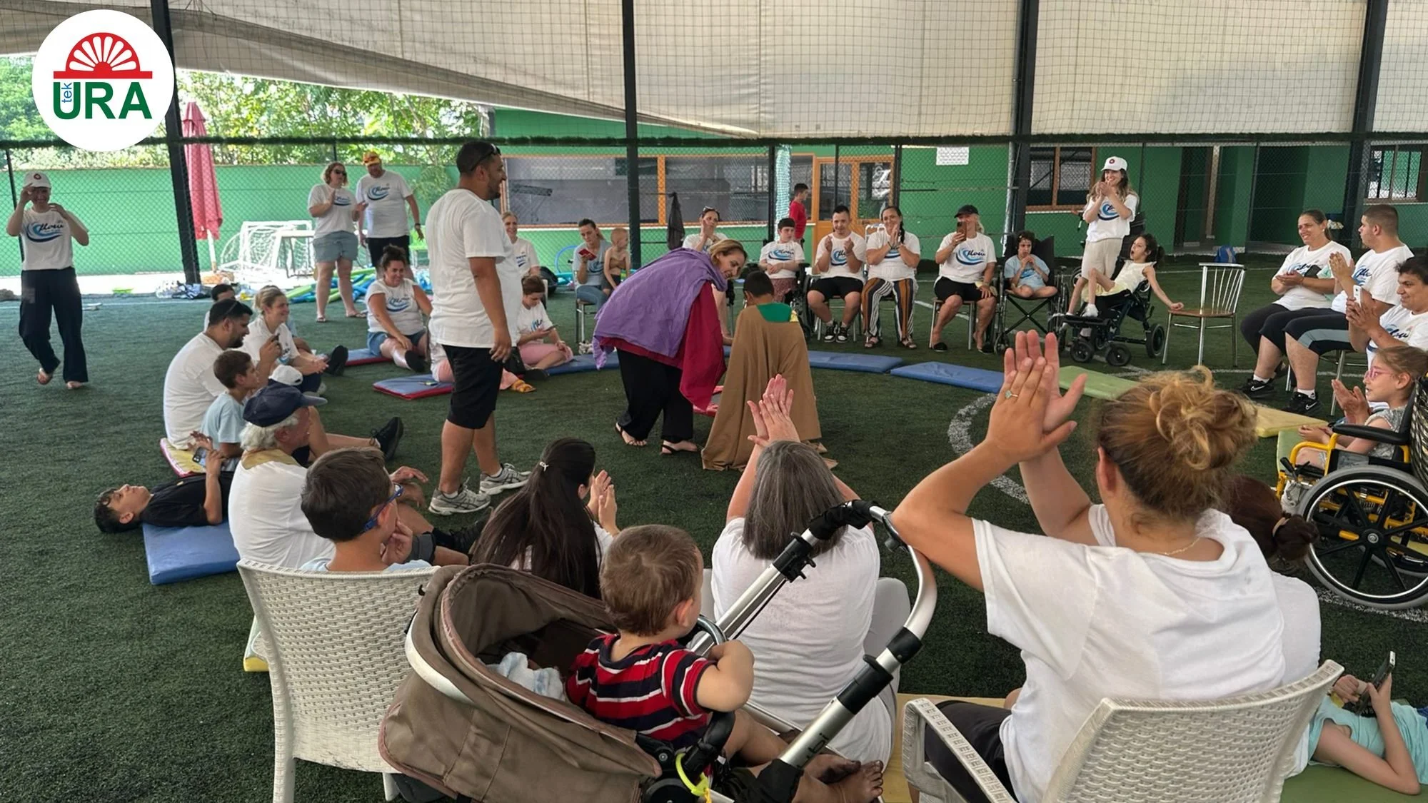 An all-ages session at Tek Ura, wheelchairs and pushchairs side by side
