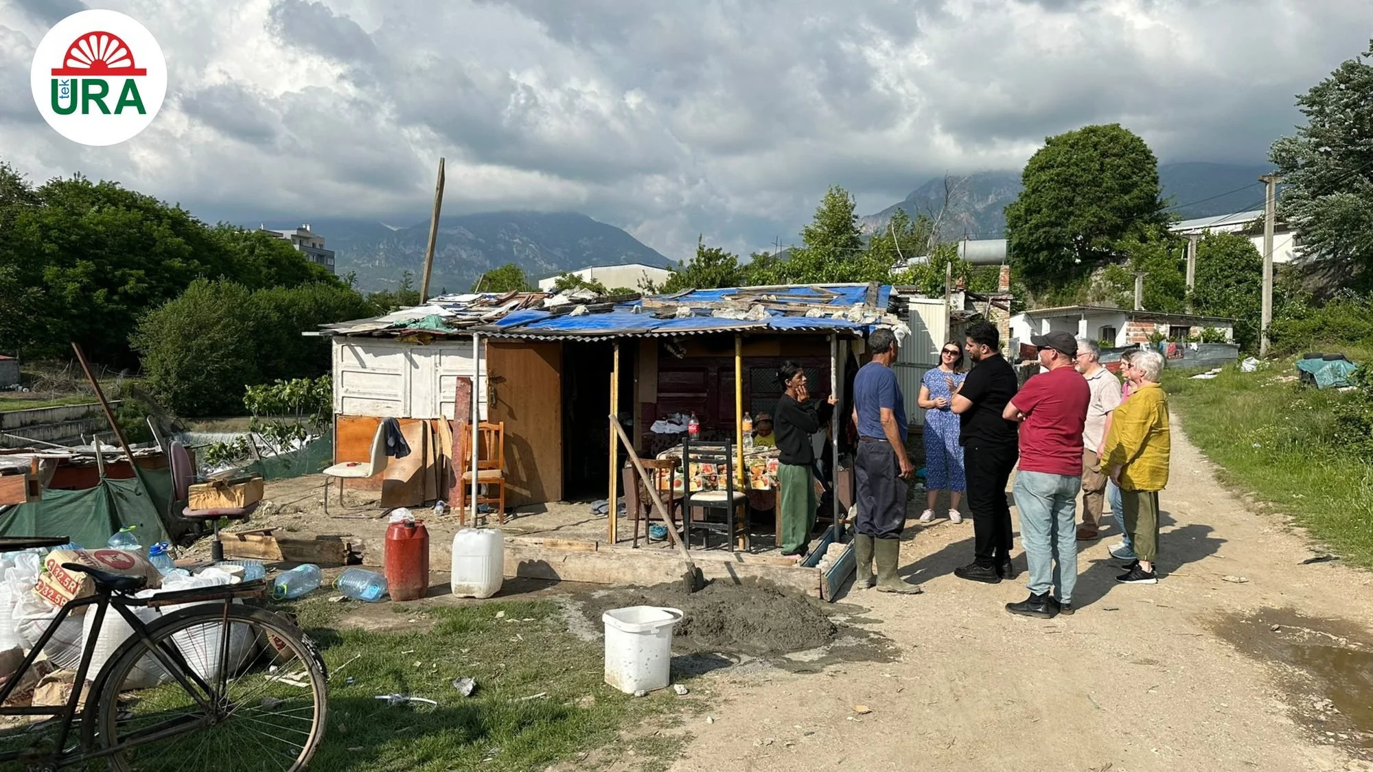Families living beside the river in Albania, where Tek Ura began its work