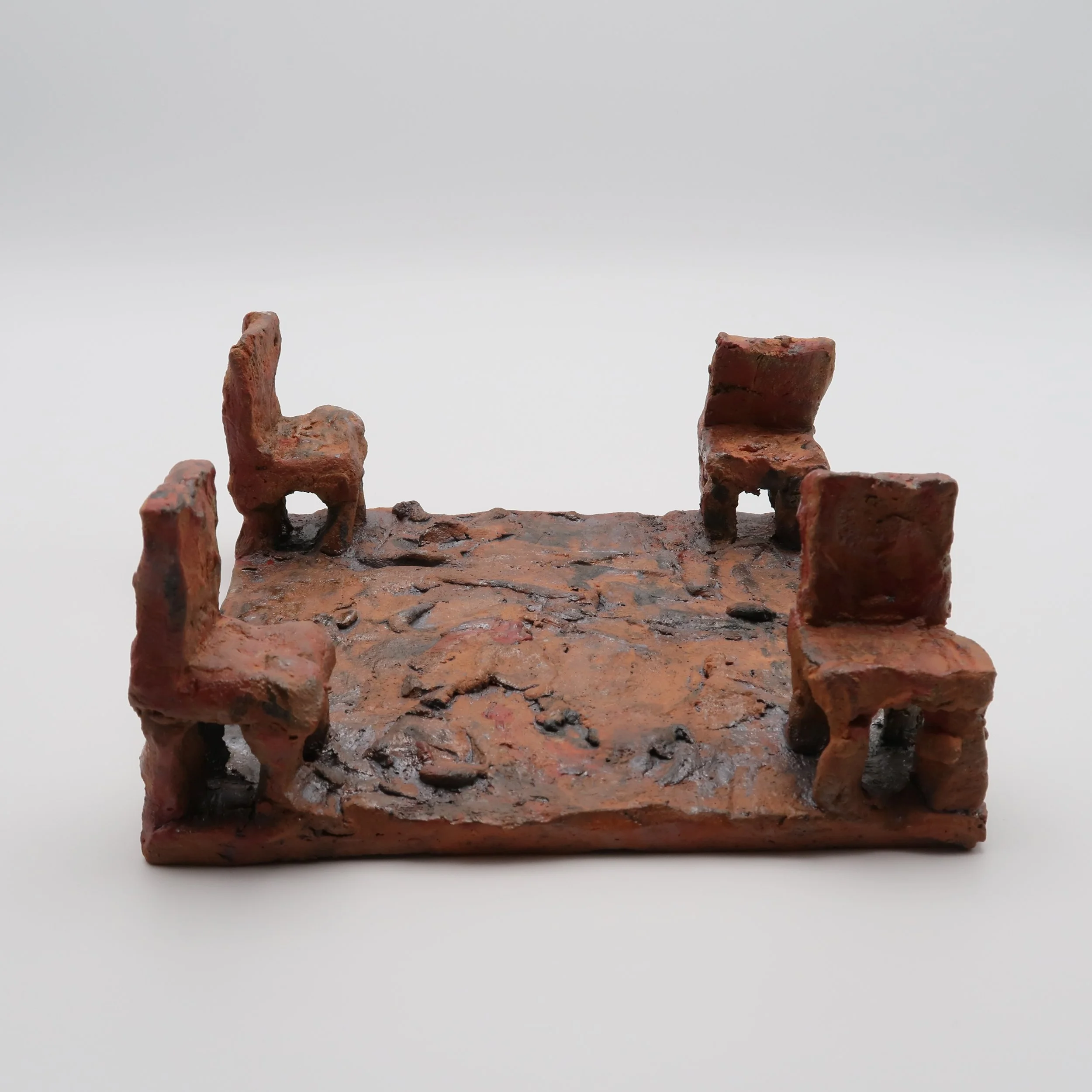 Close-up of rusty, weathered brick stairs with a plain white background.