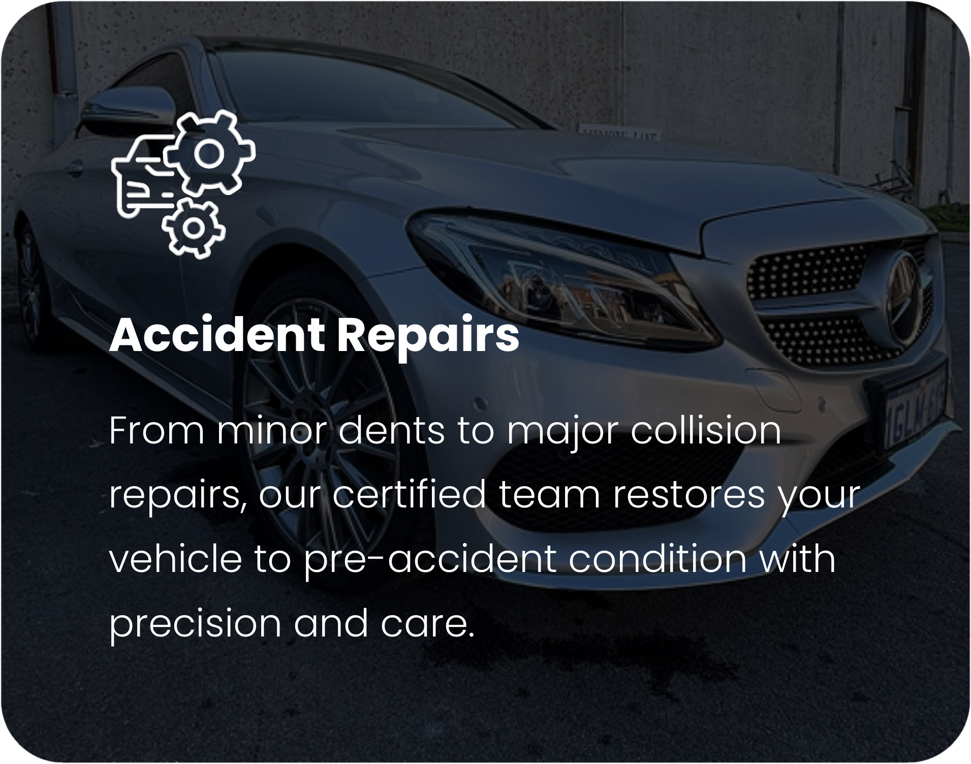 A silver luxury car with a damaged front right side parked outdoors next to a concrete wall, with a gear icon overlaid on it and text indicating accident repairs.