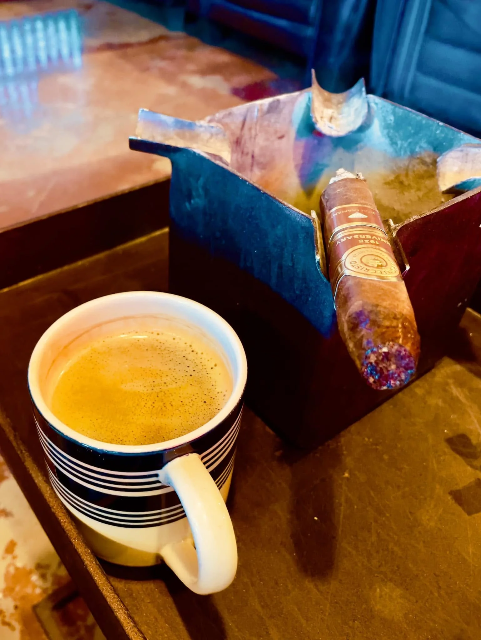Coffee and a lit cigar at En Fuego.
