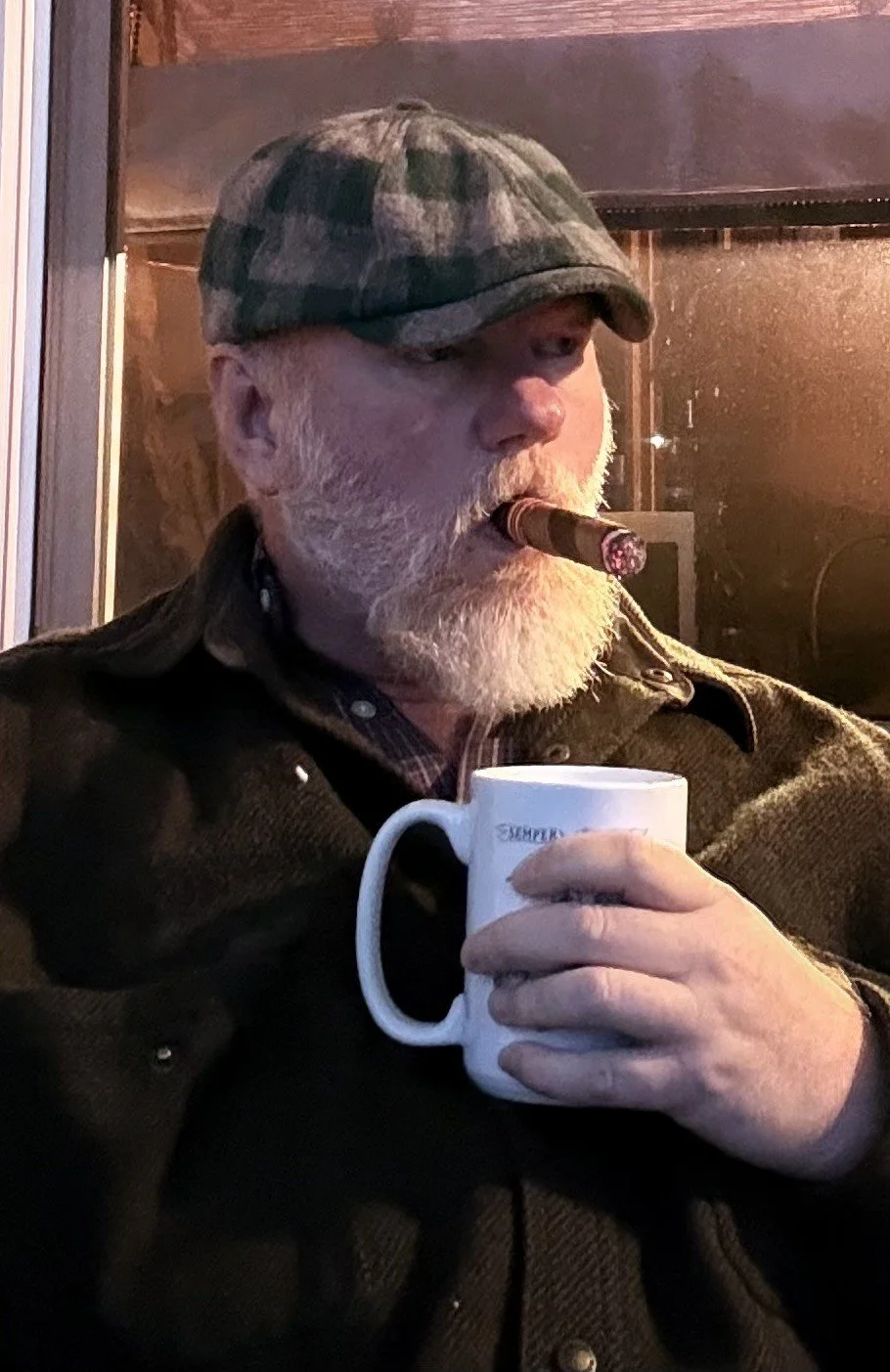Morning cigar and coffee on the Shale House porch in Alaska.