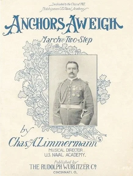 Vintage program cover featuring a black-and-white photo of a man in a military uniform with medals, surrounded by floral illustrations, titled "Anchors Aweigh" by Chas. A. Zimmermann, March Two-Step, published by Rudolph Wurlitzer Co.