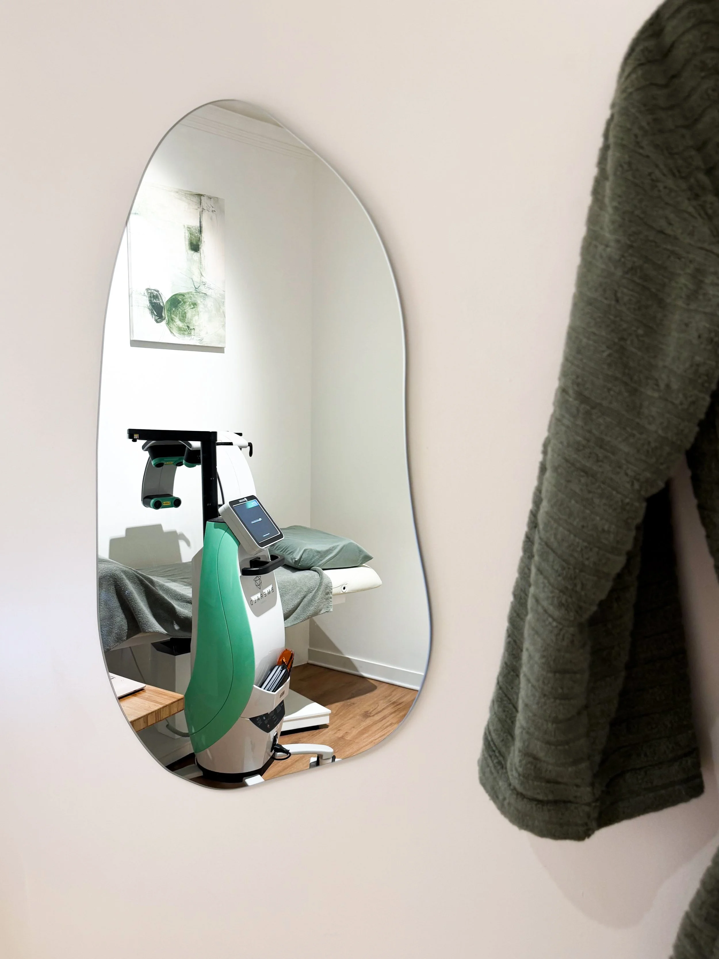 Our treatment room, designed to provide a calm and comfortable space for Emerald Laser sessions.