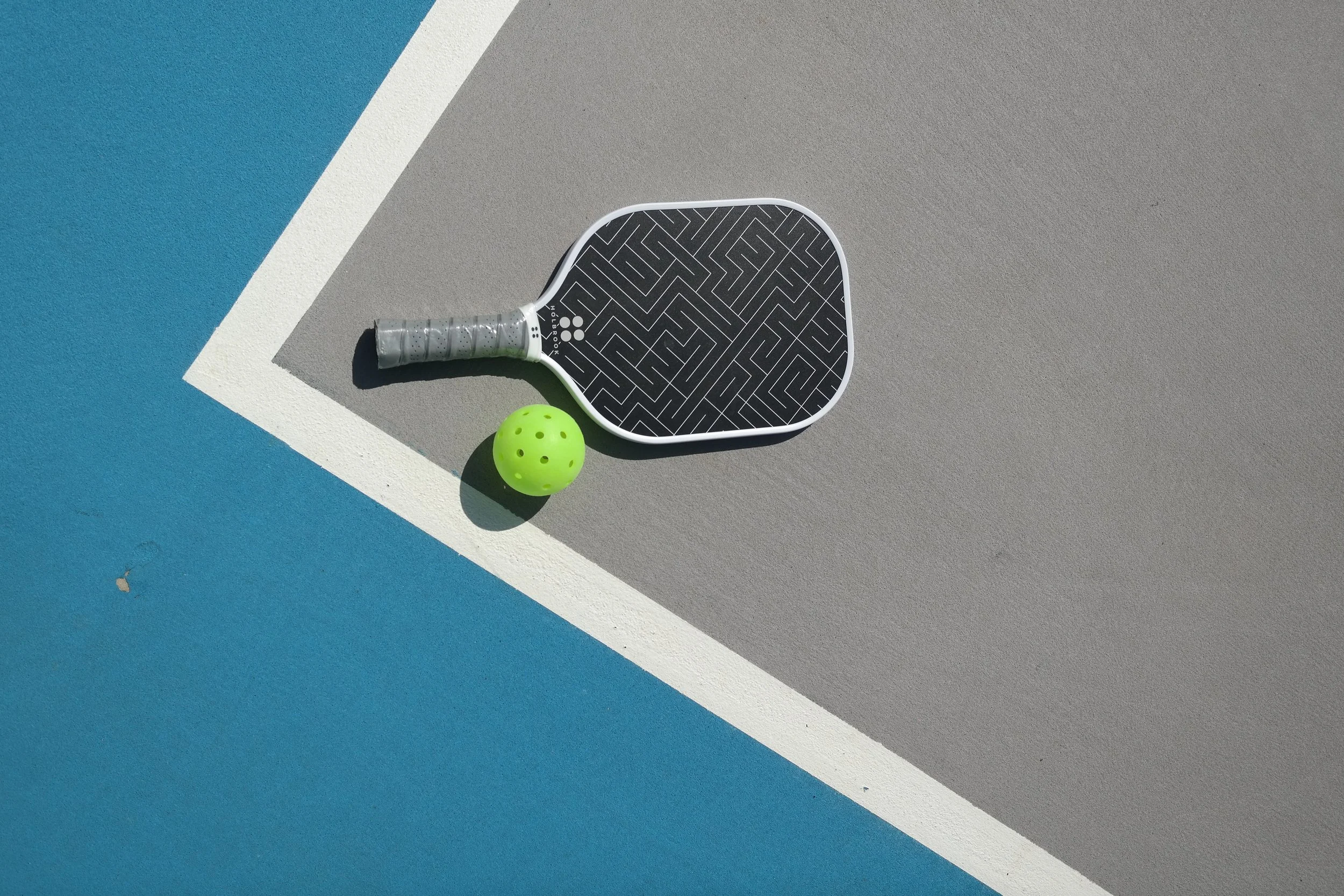 pickleball paddle and ball