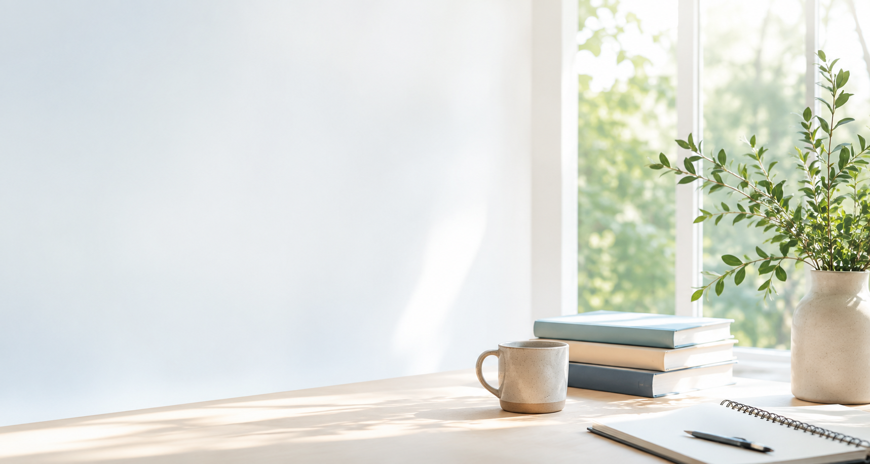 Books and notebook by a sunlit window for parent resources on learning, ADHD, giftedness and assessment