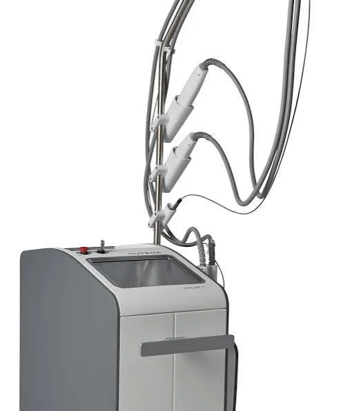 Medical laser machine with multiple handpieces and connected cables.