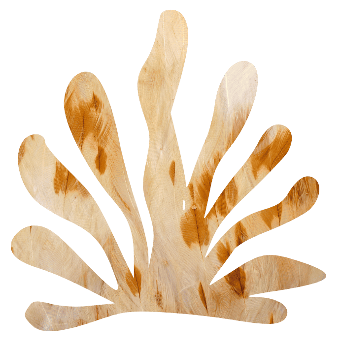 A wooden cutout of a palm tree with a black background.
