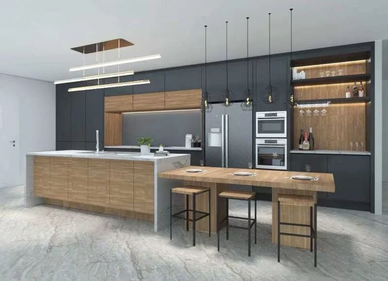 Modern kitchen with black and wood cabinets, white marble island, pendant lights, and dining table with three stools.