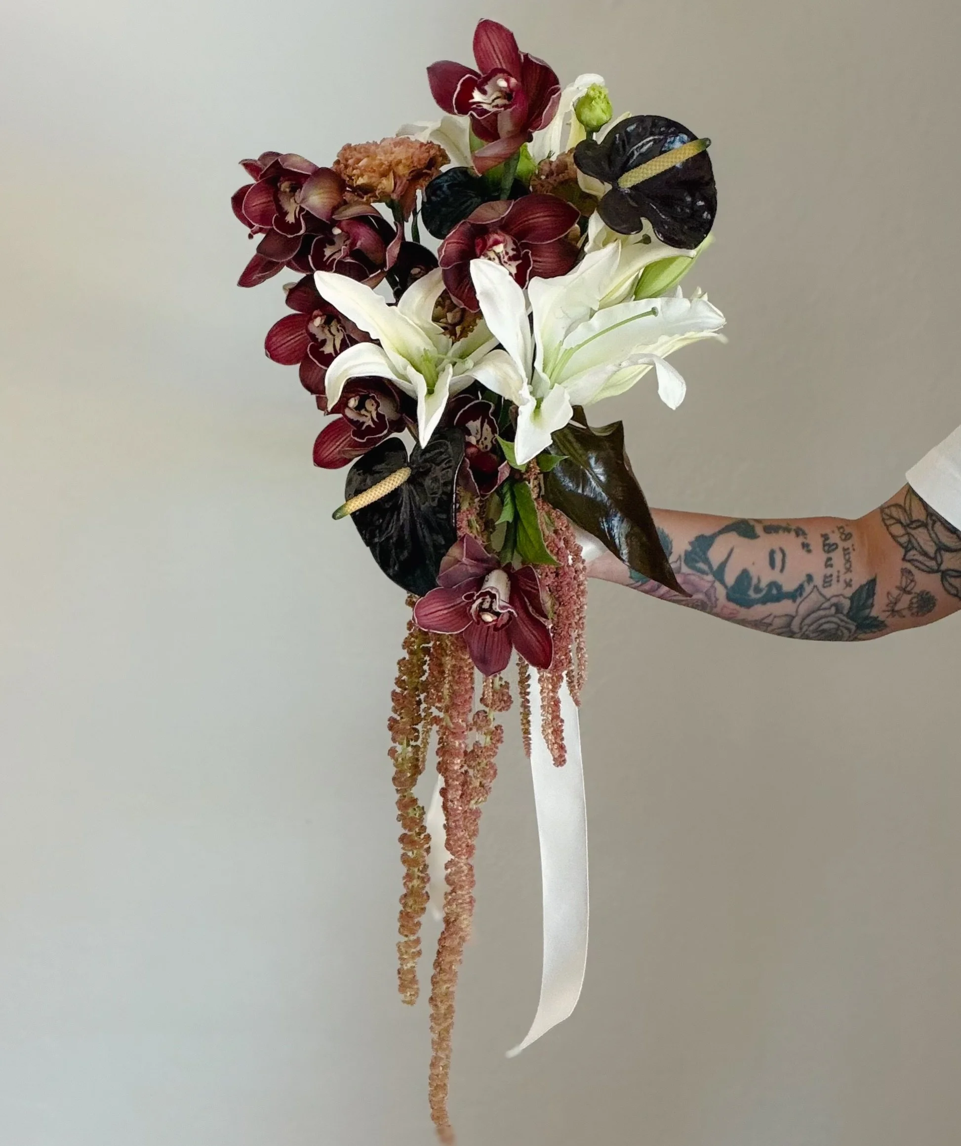 Forgot to post the stills for this bouquet I made a few weeks ago - still obsessing over this color palette, especially the cym orchids 😍🤌 
-
-
-

#sacramentoflorist
#lilybouquet 
#weddingflorist
#modernbouquet 
#burgundywedding