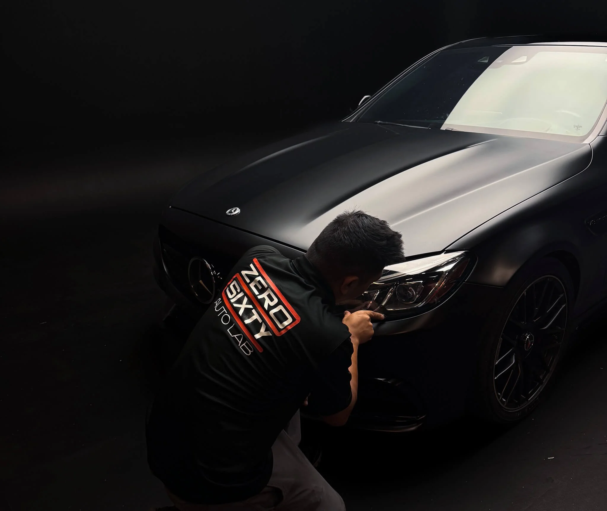 Black Mercedes AMG with matte vinyl wrap