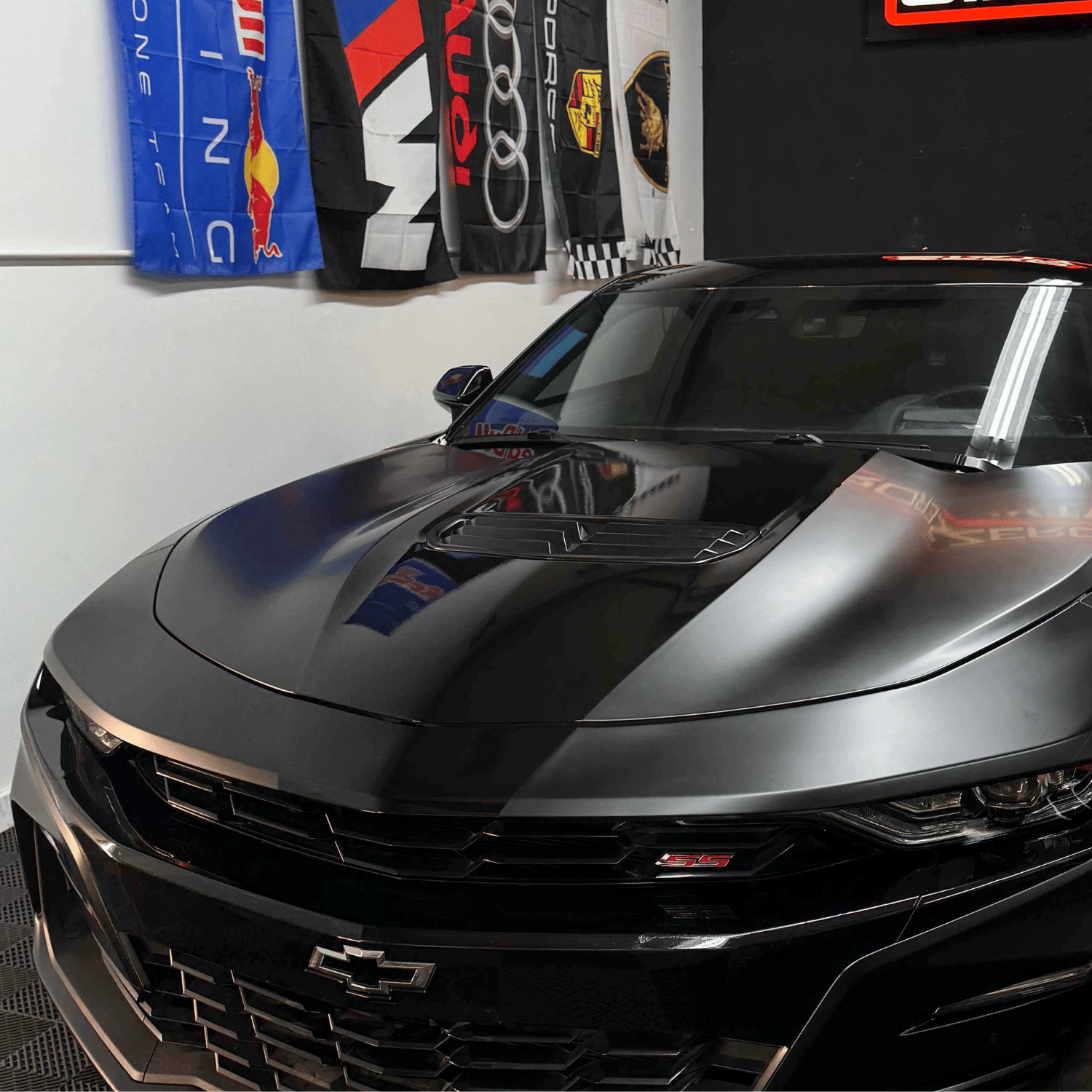 Black Chevrolet Camaro SS with vinyl wrap and custom stripes
