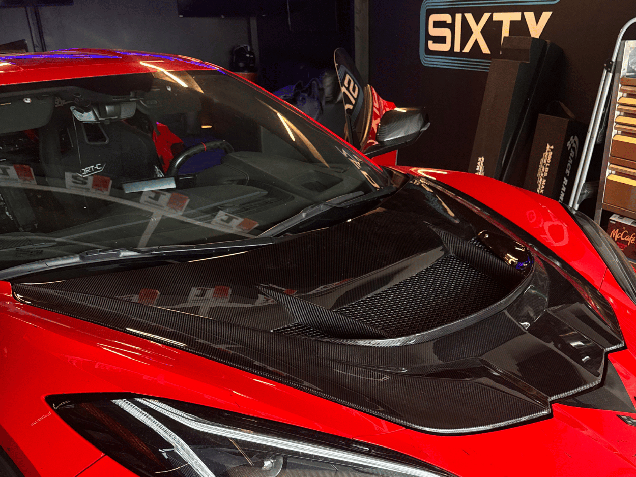 Corvette C8 with custom aftermarket hood installation.
