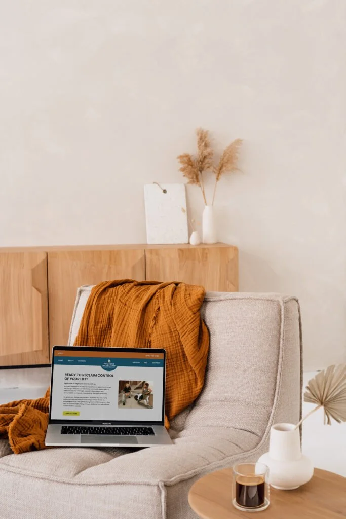 PB-Laptop-on-Chair-with-Blanket-683x1024 (1).jpg