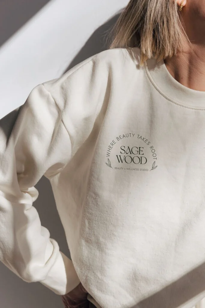 Hair salon logo displayed on a shirt