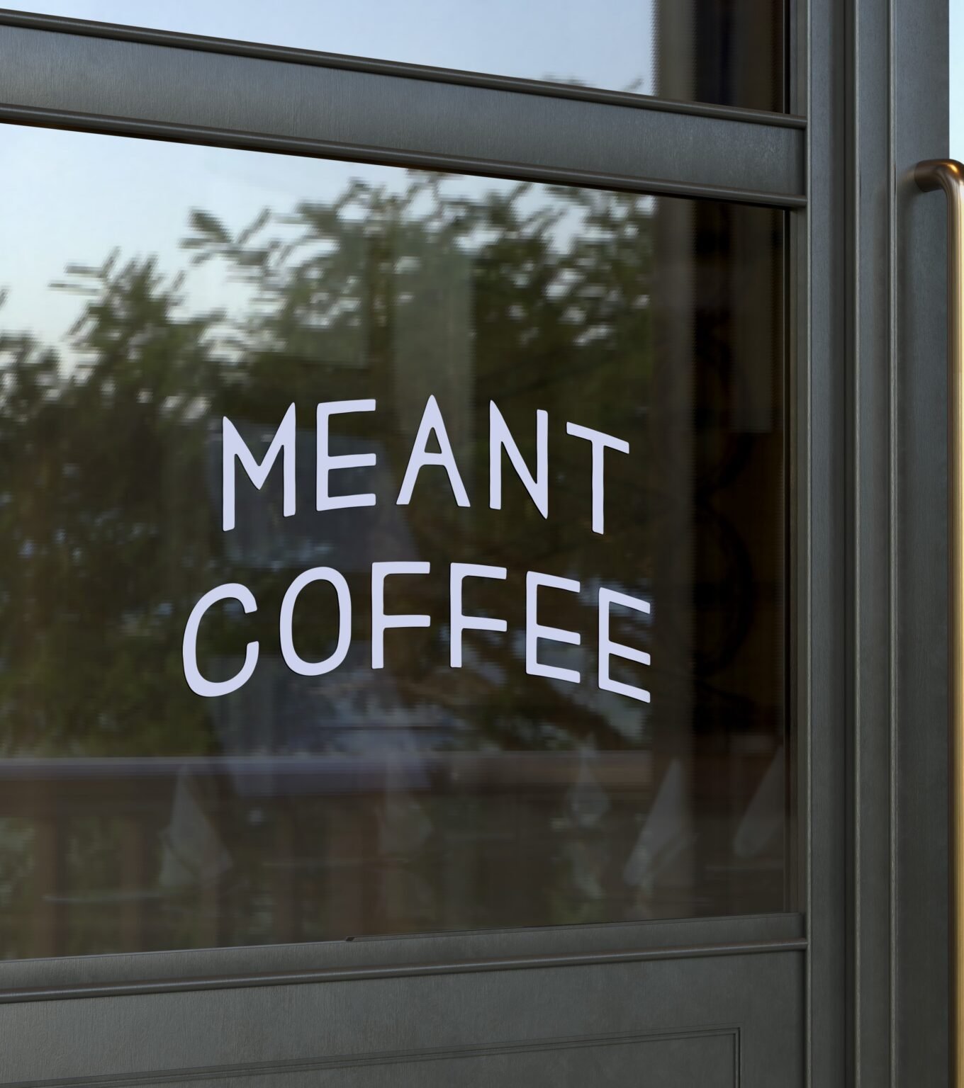 Meant Coffee logo displayed on a glass door
