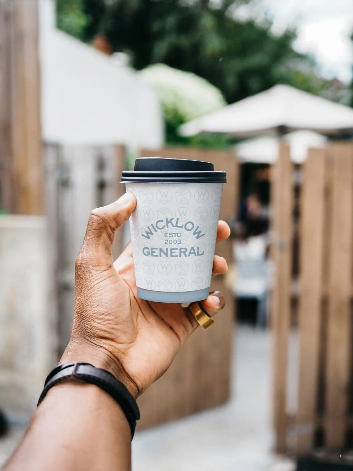 Retro coffee brand design displayed on a cup.