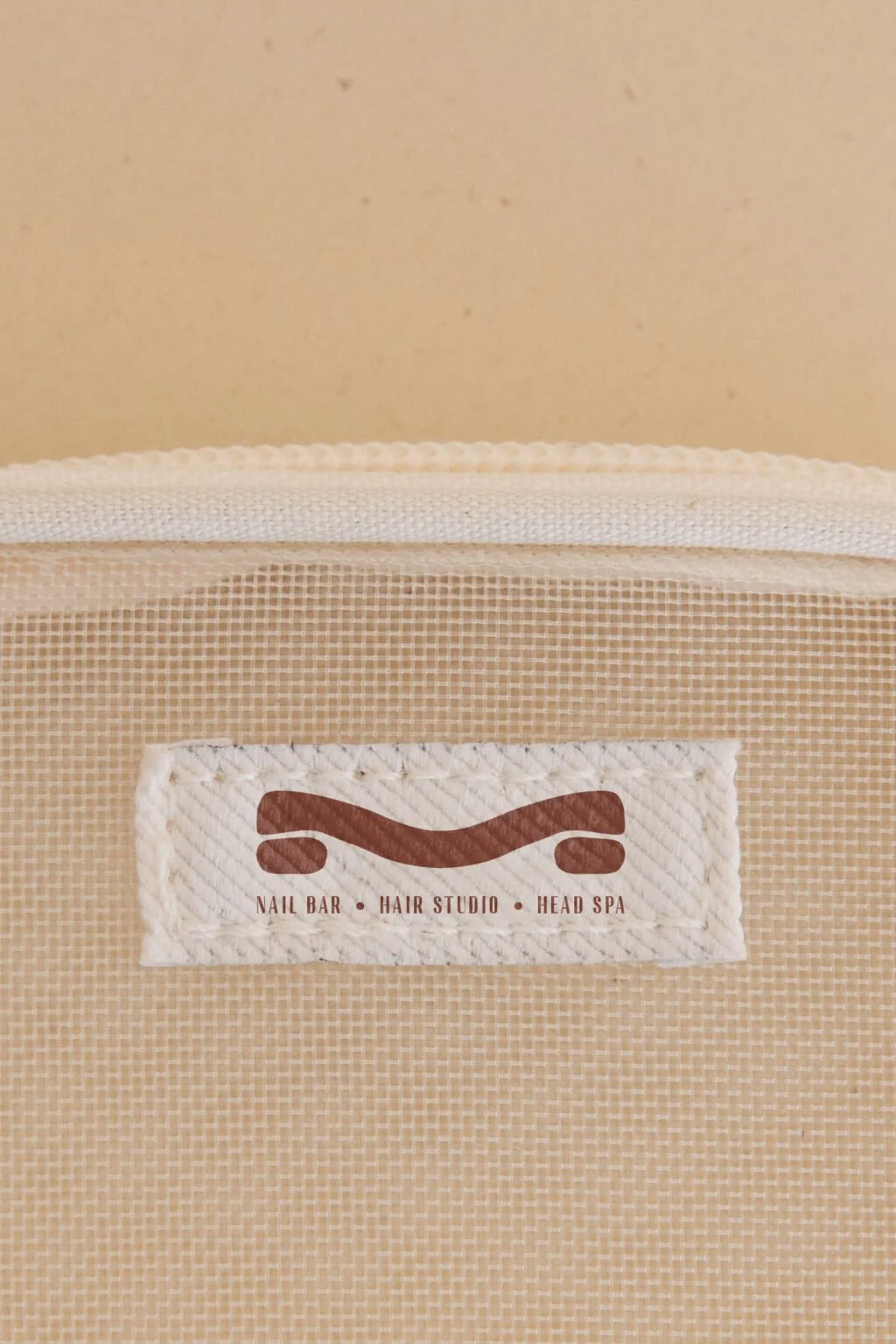 Mesh Hair Studio logo on a printed tag