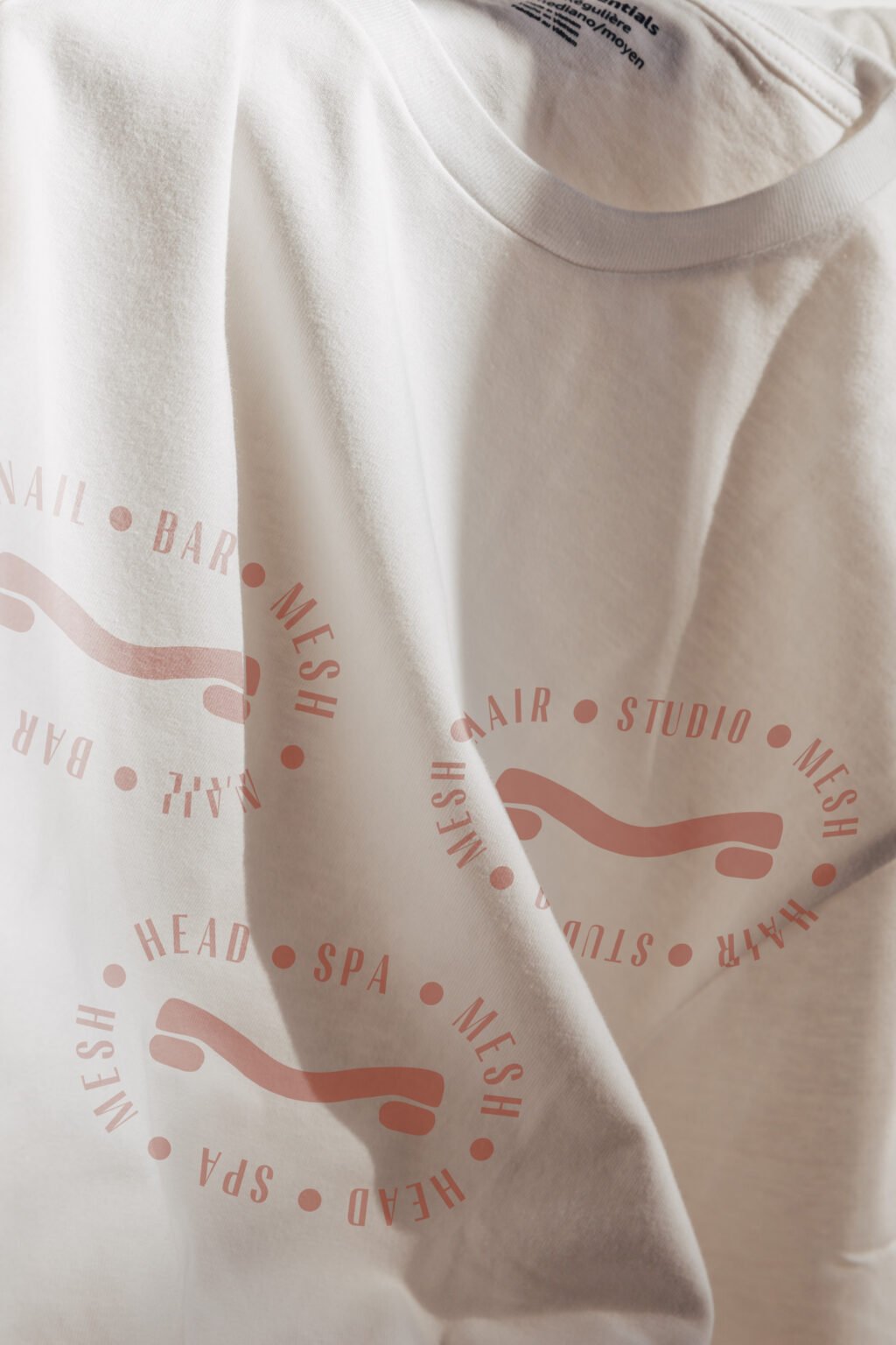 Mesh logo displayed on a shirt.