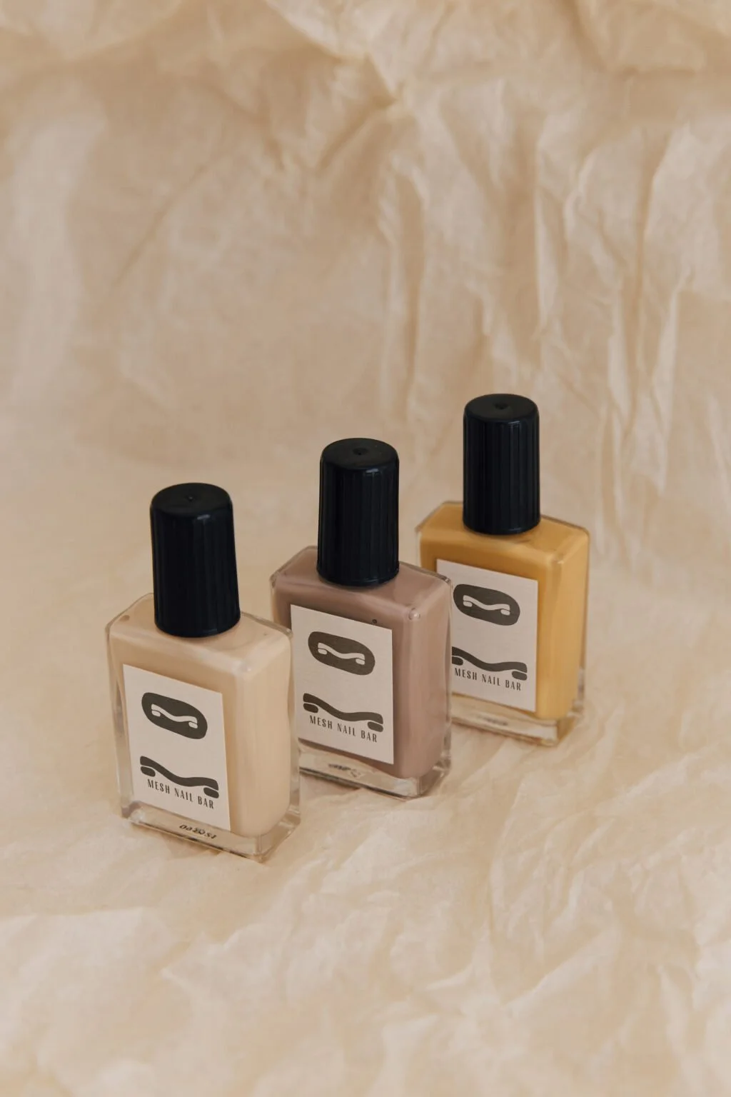 Mesh logo on nail polish packaging.