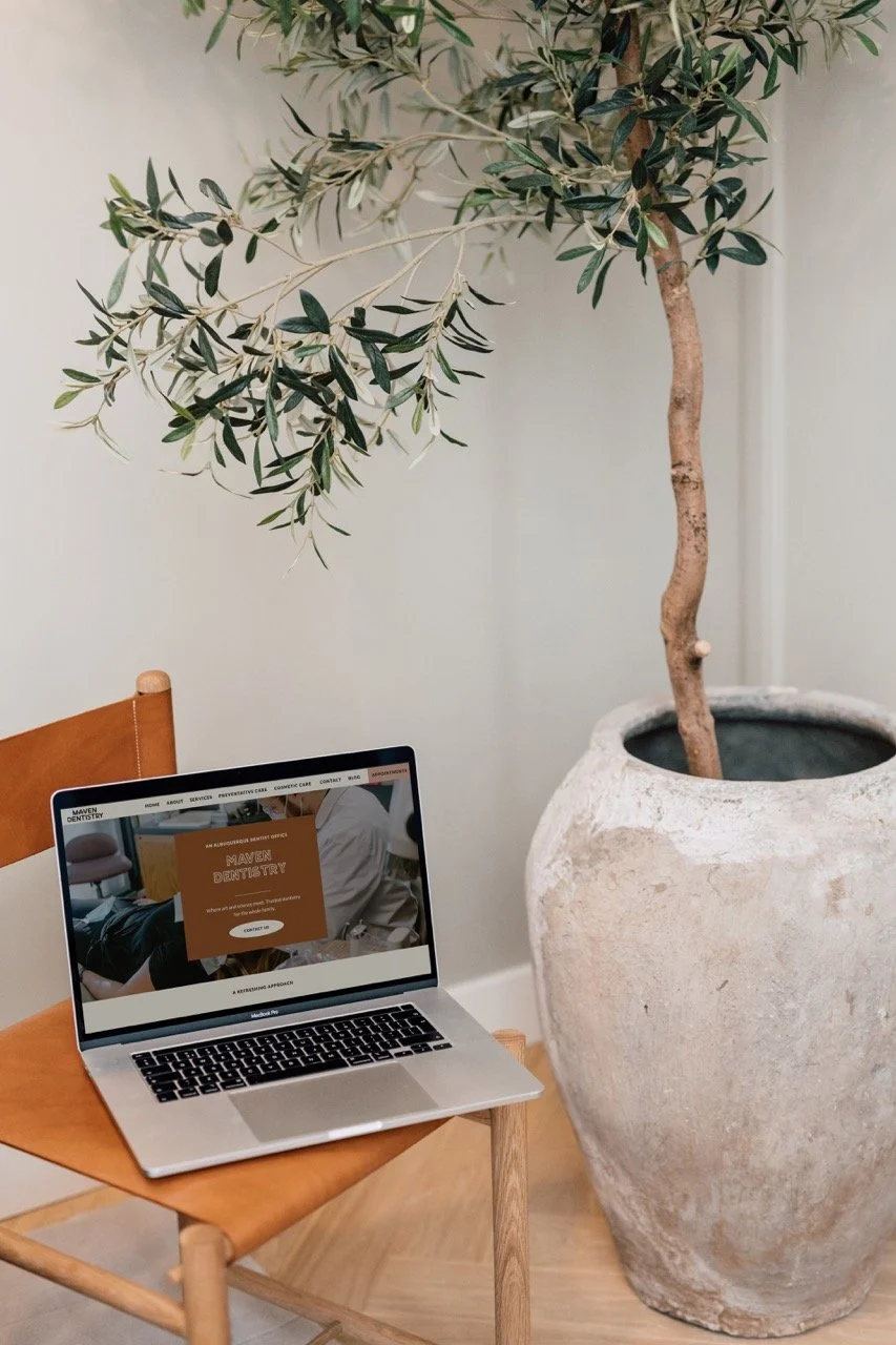 Modern dentist website displayed on a laptop.
