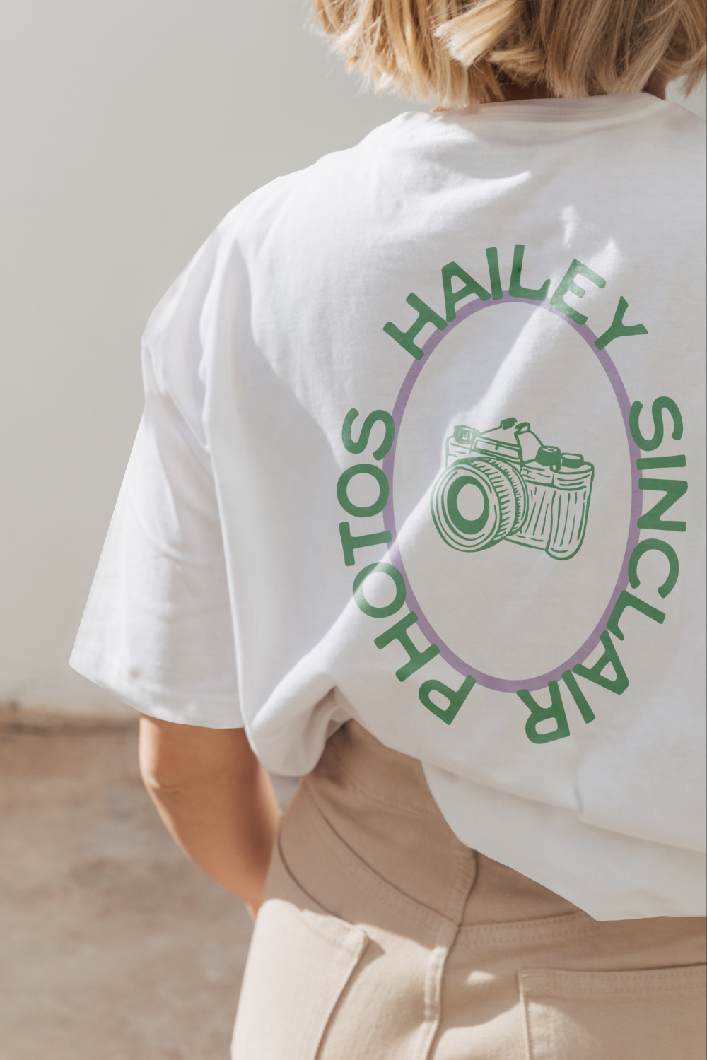 Vintage-style photography logo on the back of a T-shirt